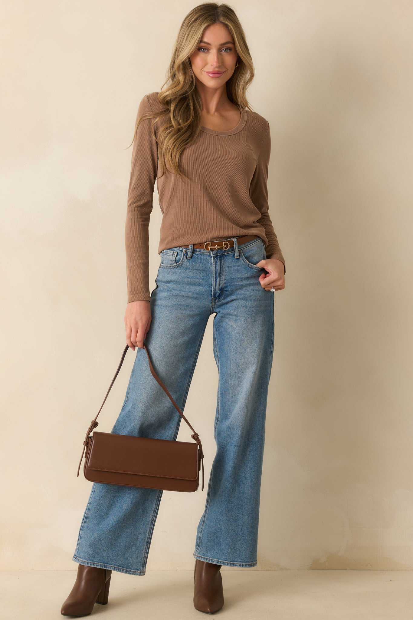Long-sleeve mocha brown top with a relaxed silhouette and smooth finish.