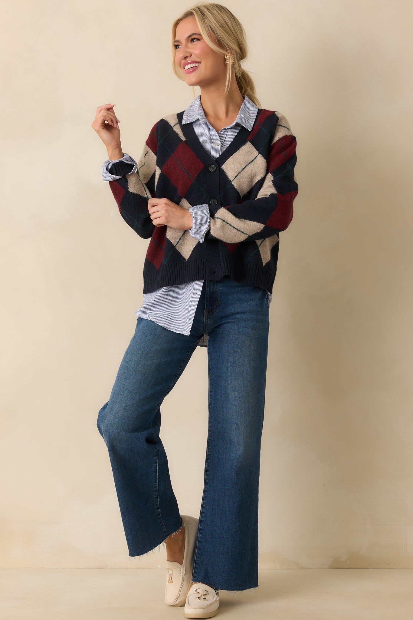 Long-sleeve cardigan in navy featuring functional button front and ribbed hems.