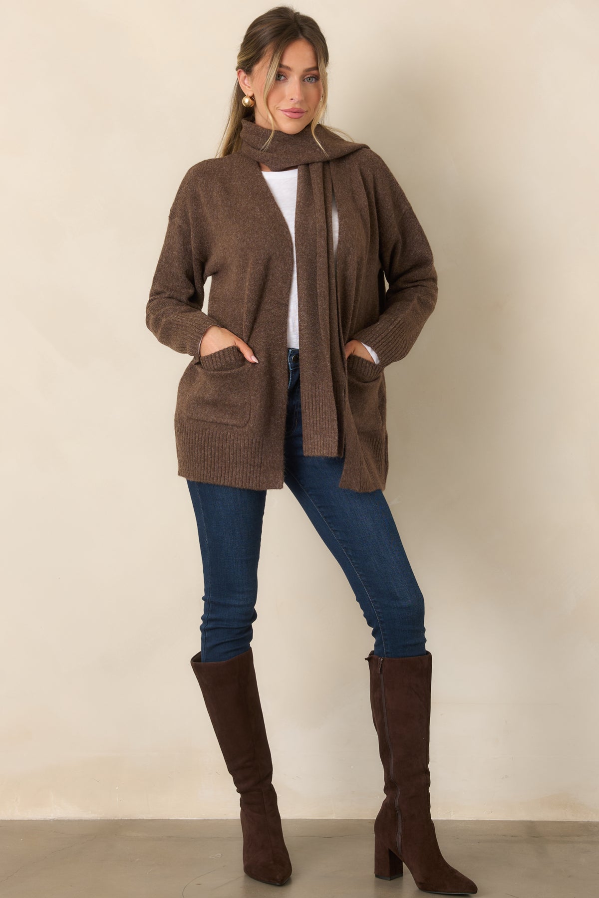 Long-sleeve cardigan featuring a softly relaxed silhouette and ribbed trim along the cuffs and hem.