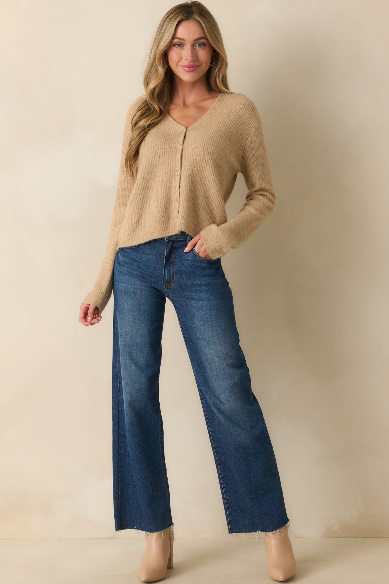 Long-sleeve ribbed cardigan featuring a functional button front with tonal buttons.