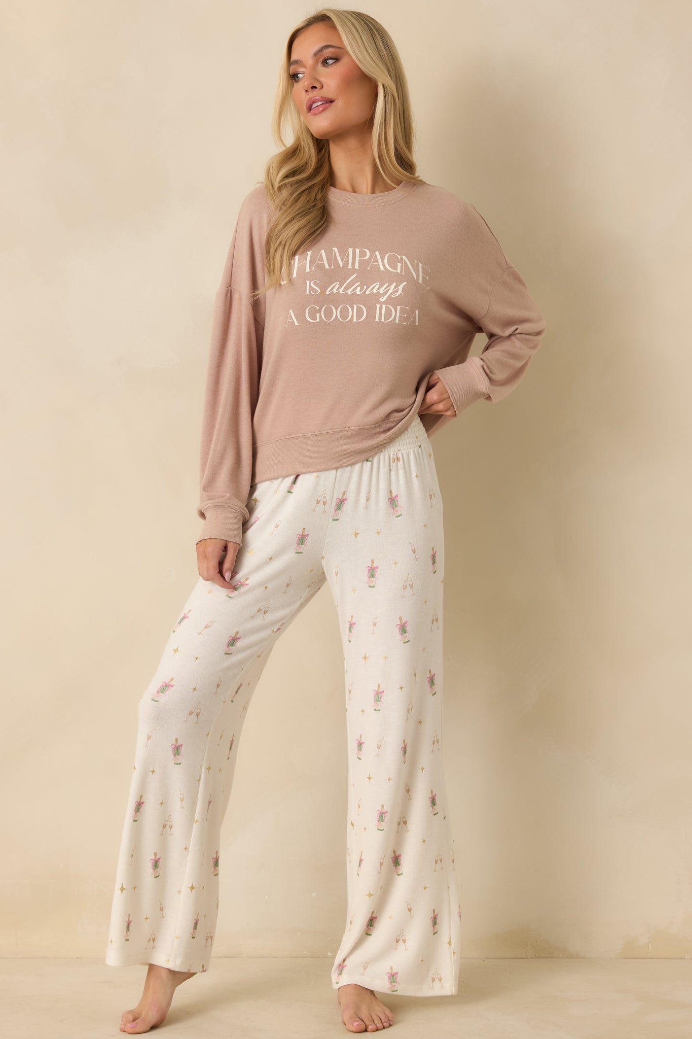 Taupe long sleeve top showing relaxed fit with crew neckline and dropped shoulders.