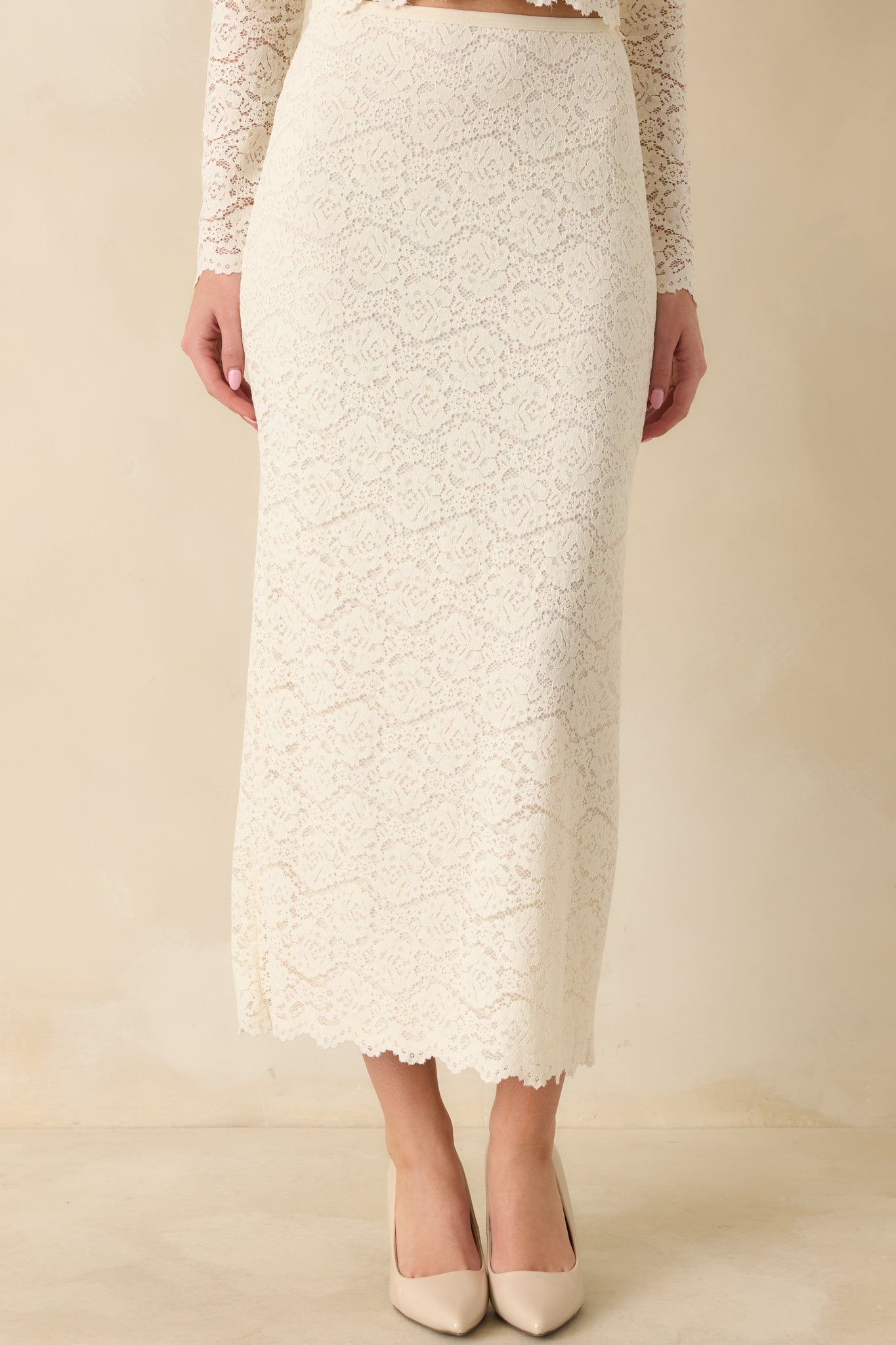 Lower-half crop highlighting the straight silhouette, lace overlay, and back slit for movement.