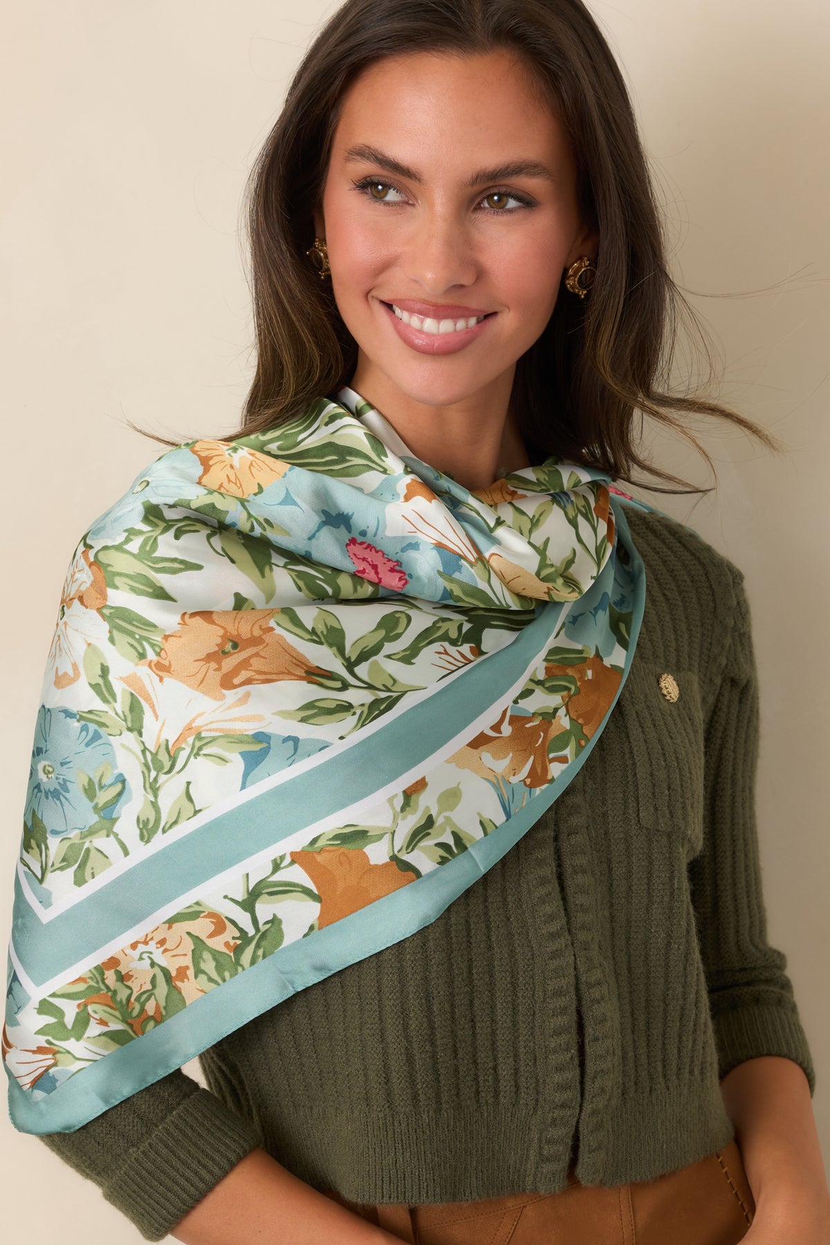 Softly lustrous botanical scarf showcasing large floral blooms framed by a coordinating sage blue border.