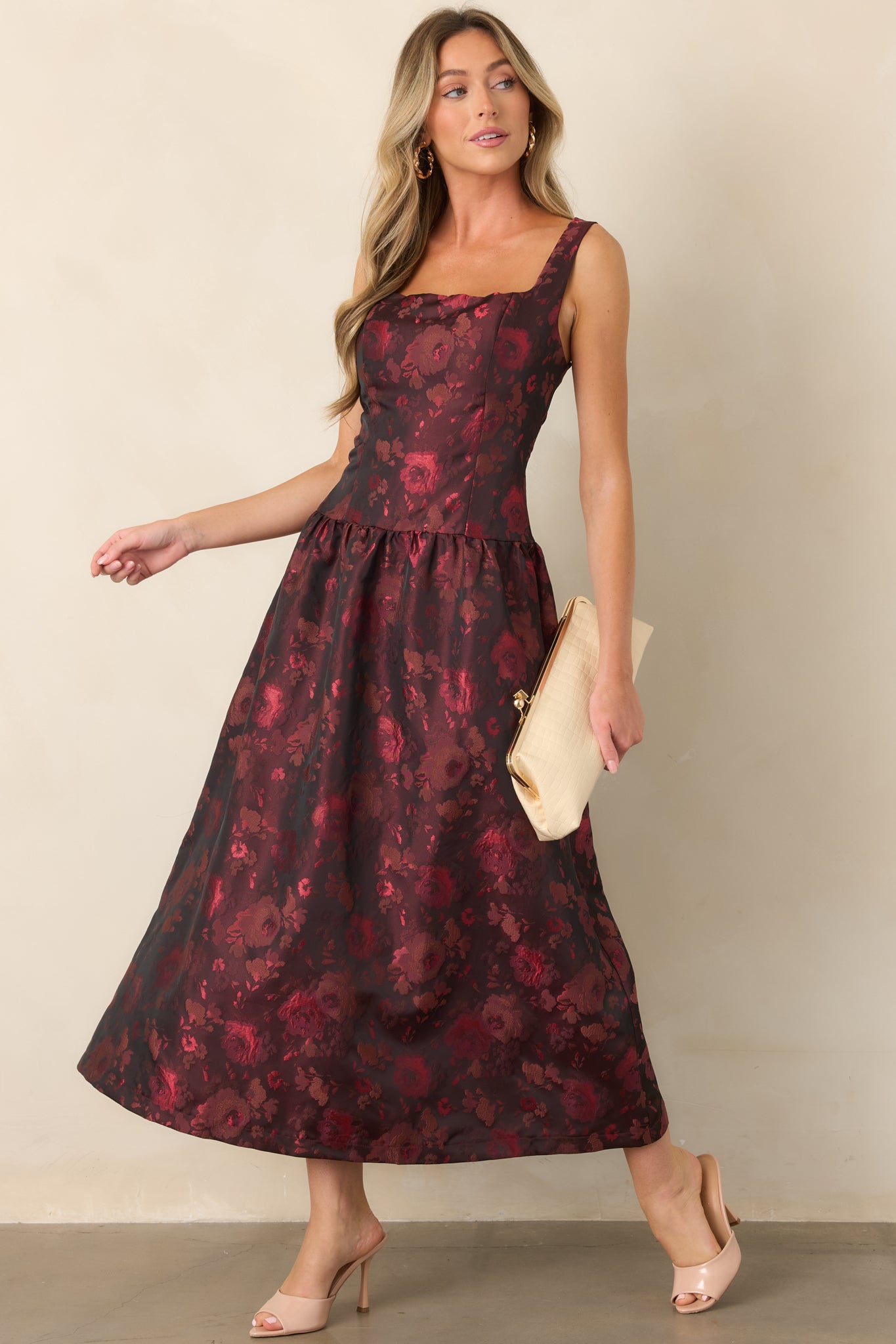 Floral woven dress showcasing its softly lustrous finish, structured square neckline, sleeveless bodice, and flowing gathered midi skirt.
