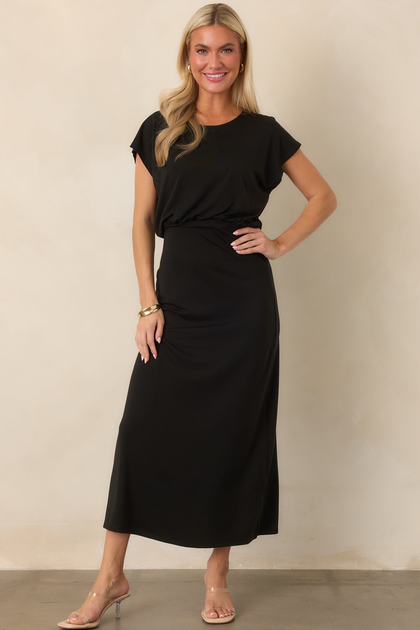 Luxe stretch jersey midi dress featuring a crew neckline, short sleeves, softly gathered blouson bodice, and streamlined skirt.