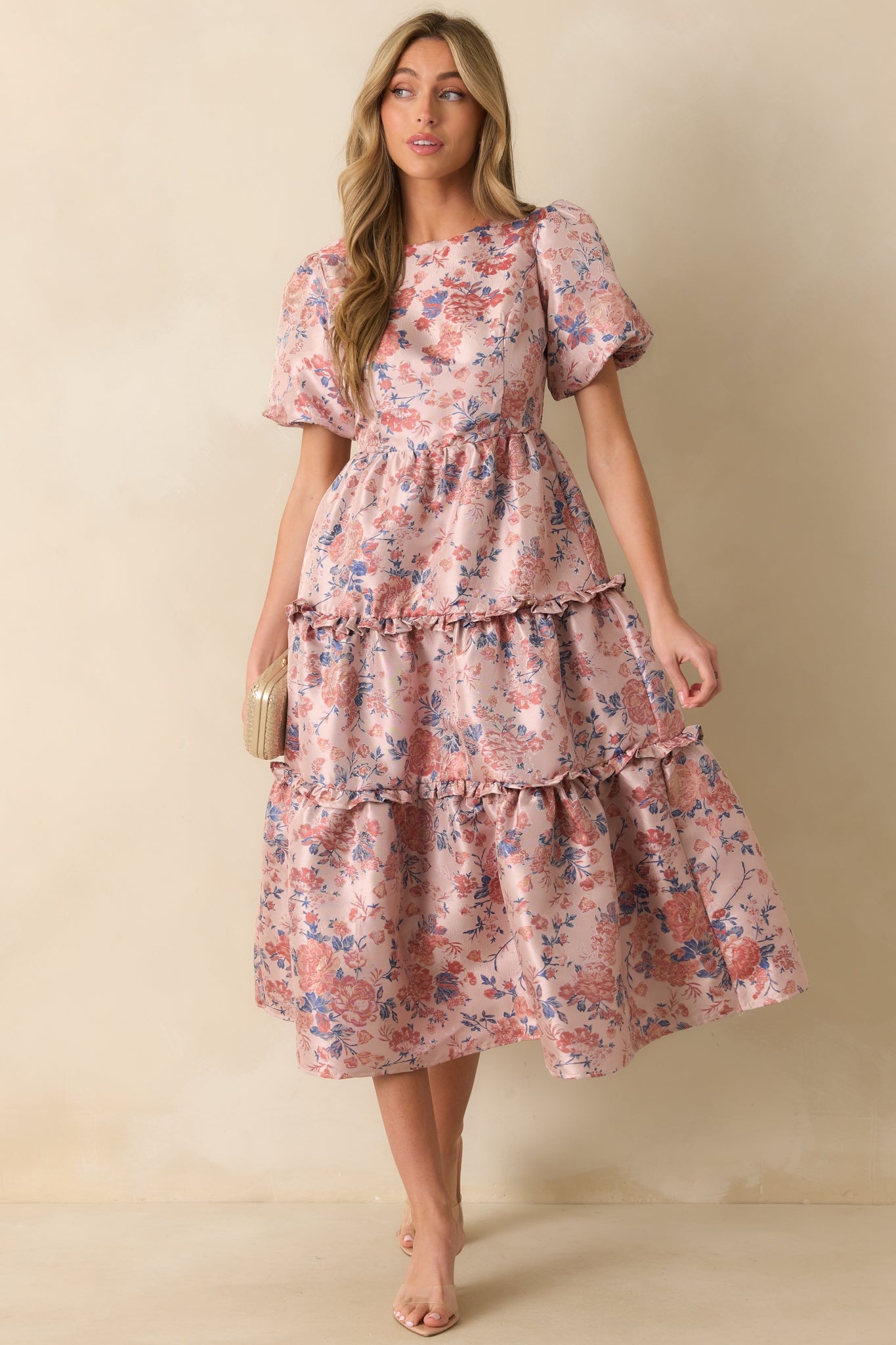 Short-sleeve mauve dress with flowing tiered skirt and textured floral jacquard fabric.