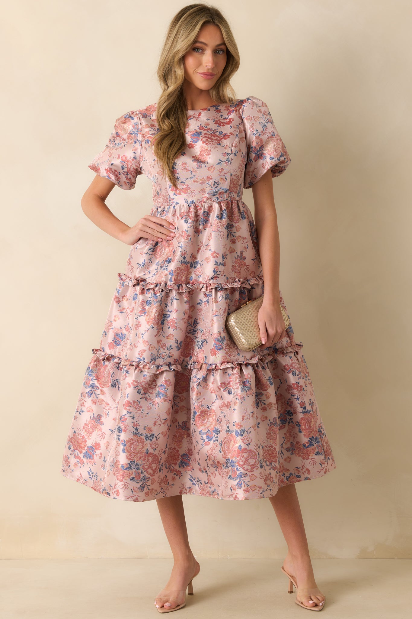 Flowing mauve floral jacquard dress featuring open back with self-tie bow and textured tiered skirt.