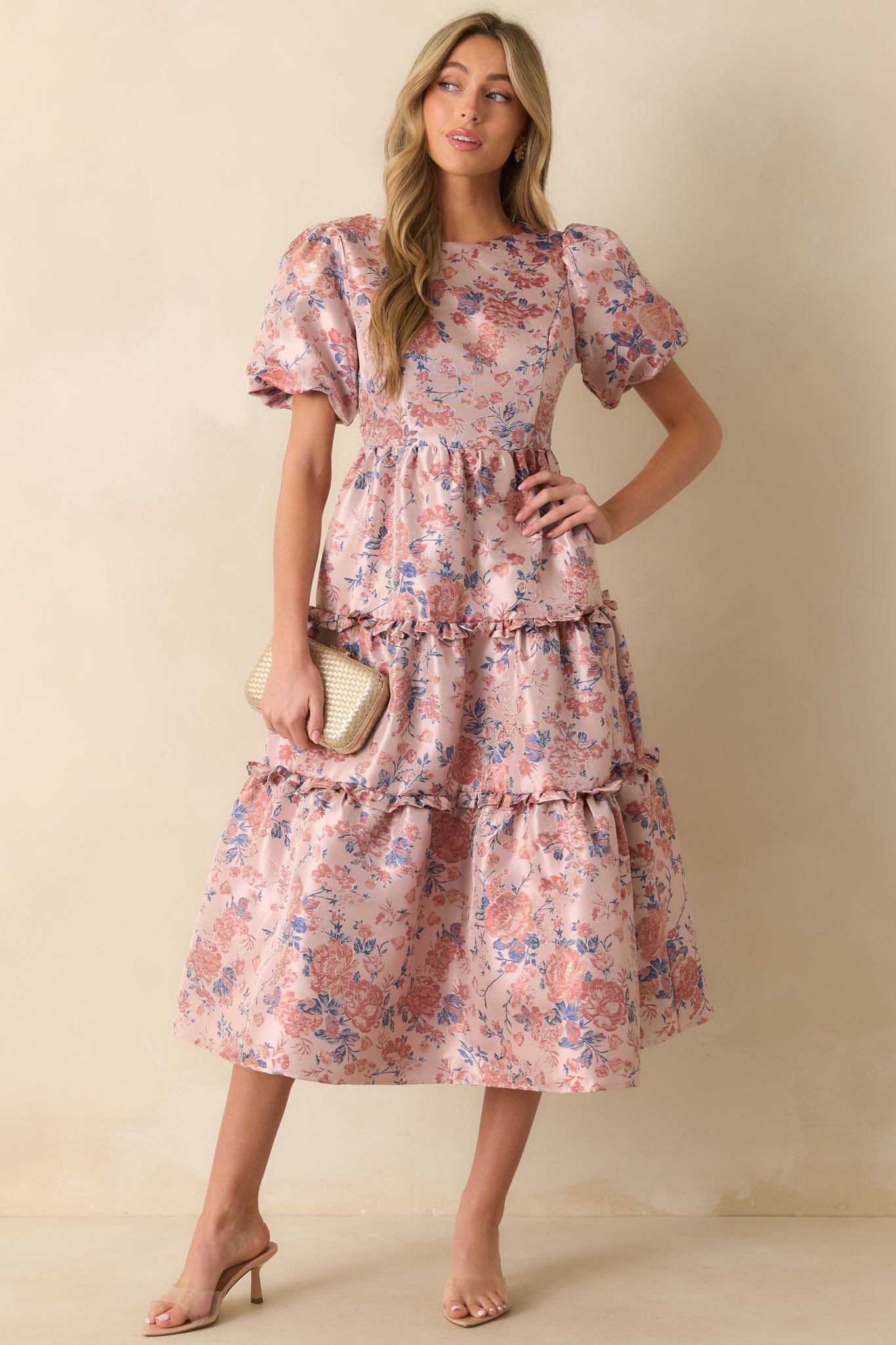 Mauve midi dress with round neckline, short puff sleeves, and tiered skirt with ruffle accents.