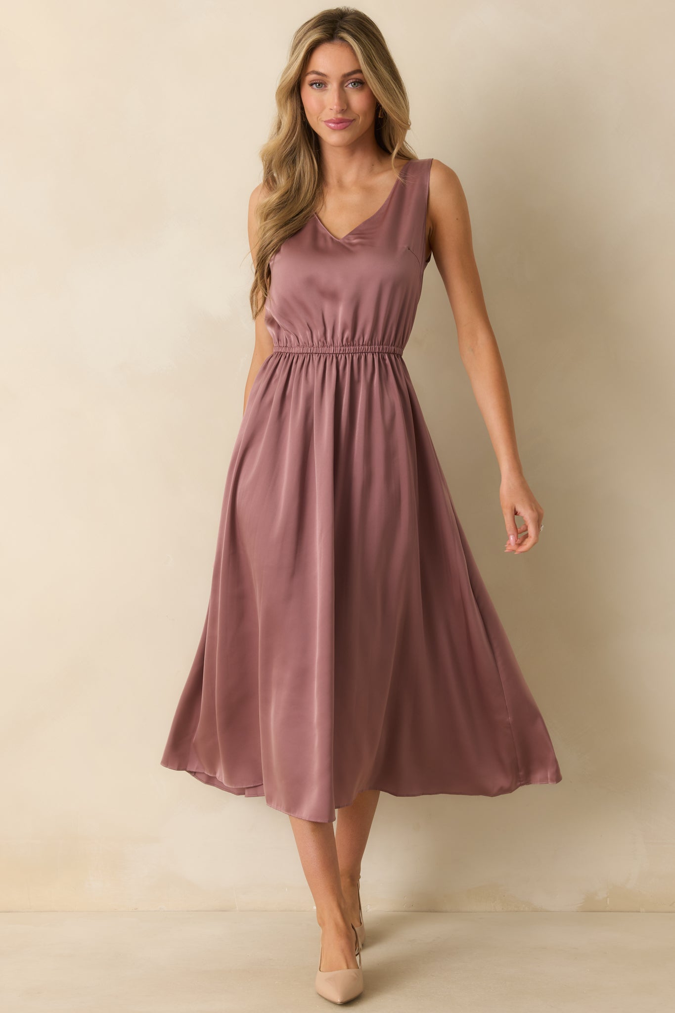 Elegant sleeveless mauve satin dress without the sweater, showing the smooth fabric and relaxed maxi length.