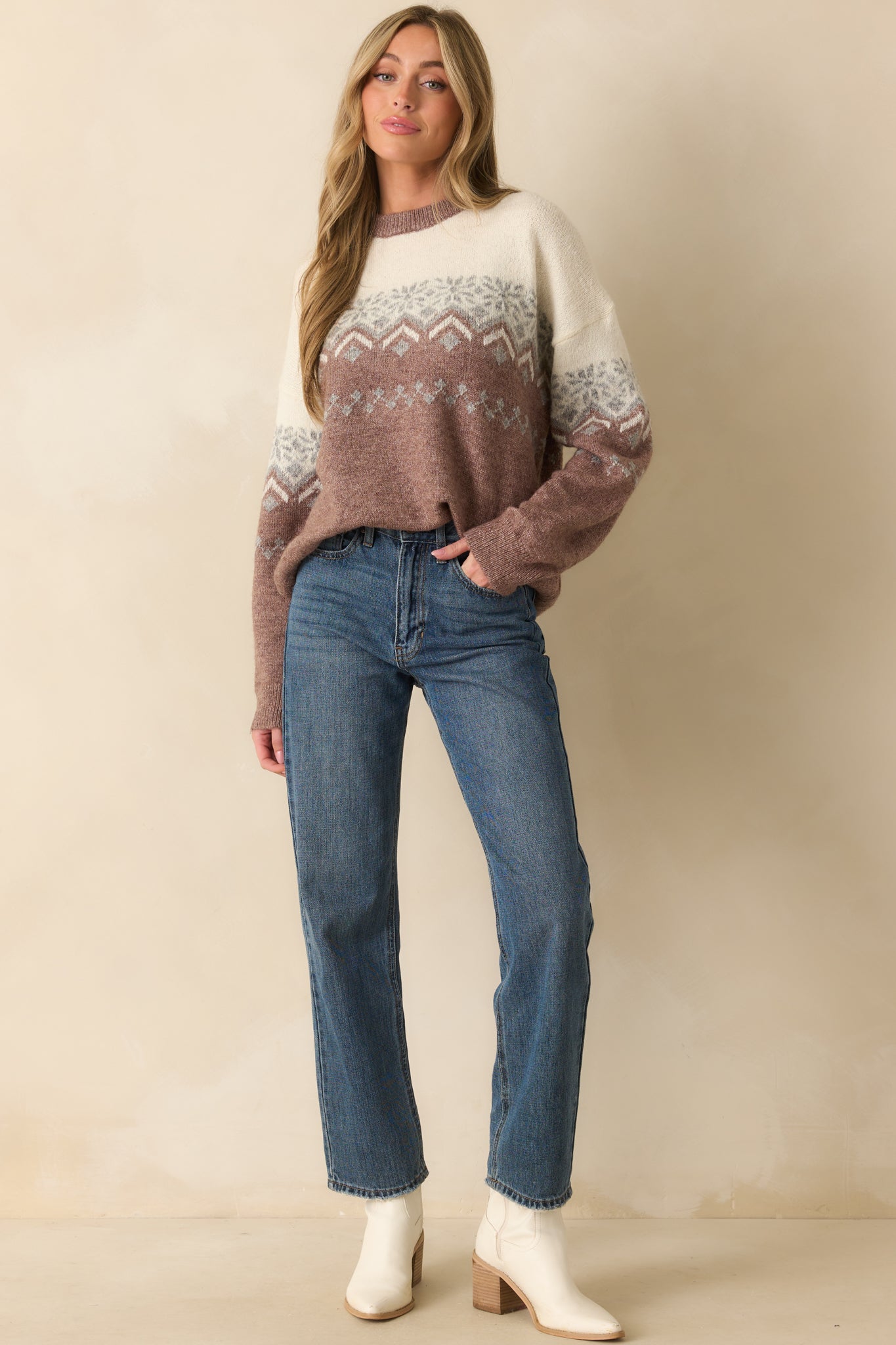 Mauve sweater with a crew neckline and long sleeves, featuring a classic cream and grey Fair Isle pattern and relaxed fit.