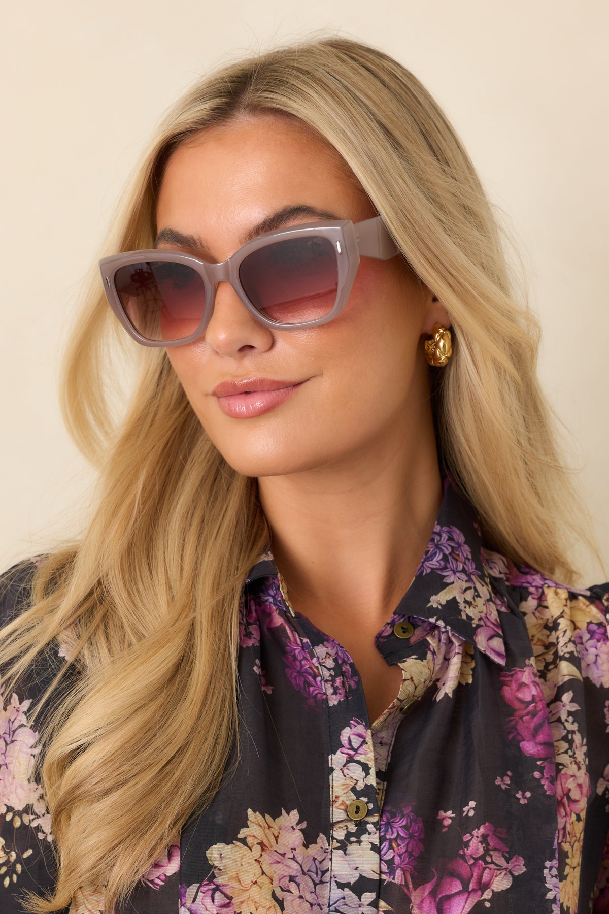 Glossy mauve taupe sunglasses with oversized square frames, subtle cat-eye corners, and brown gradient lenses.