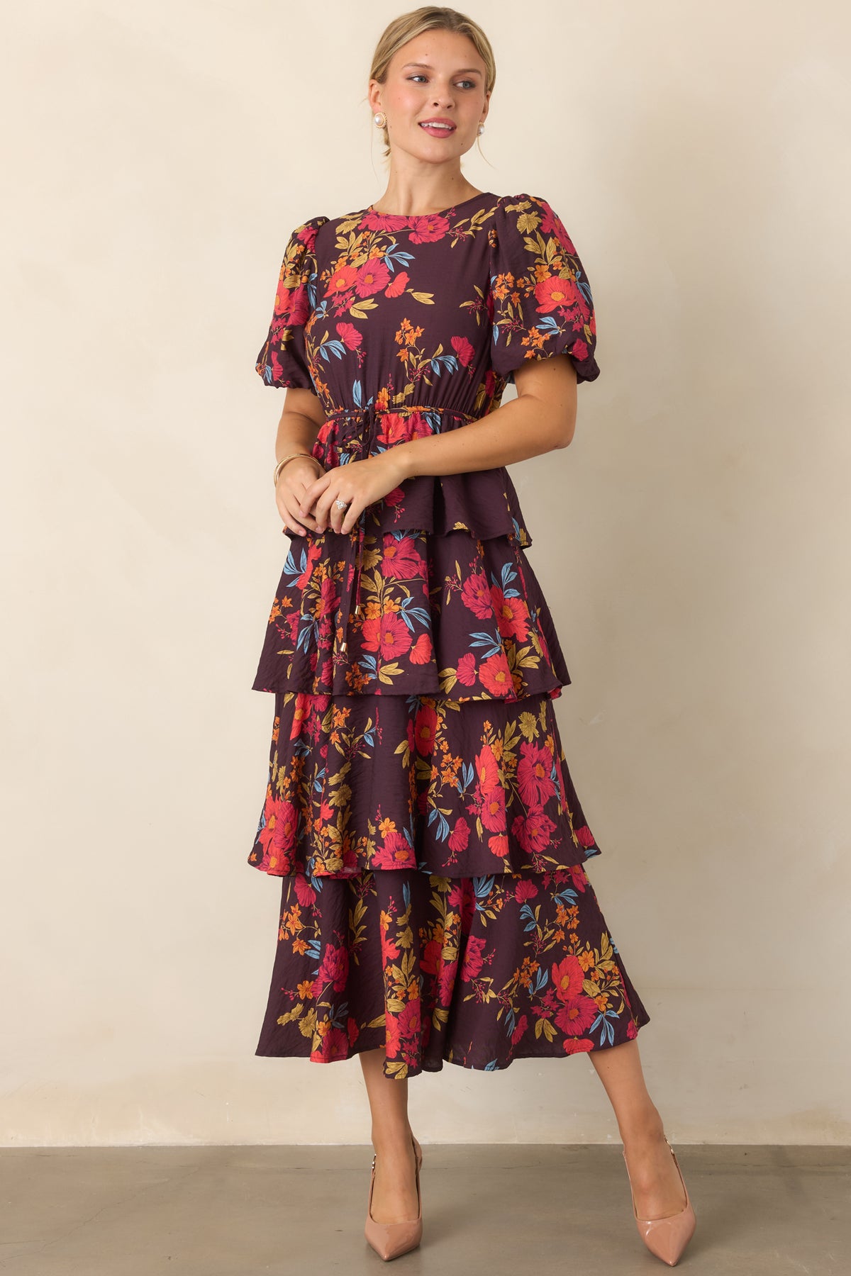 Maxi dress with short puff sleeves, tiered skirt, and flowing movement through the waist.