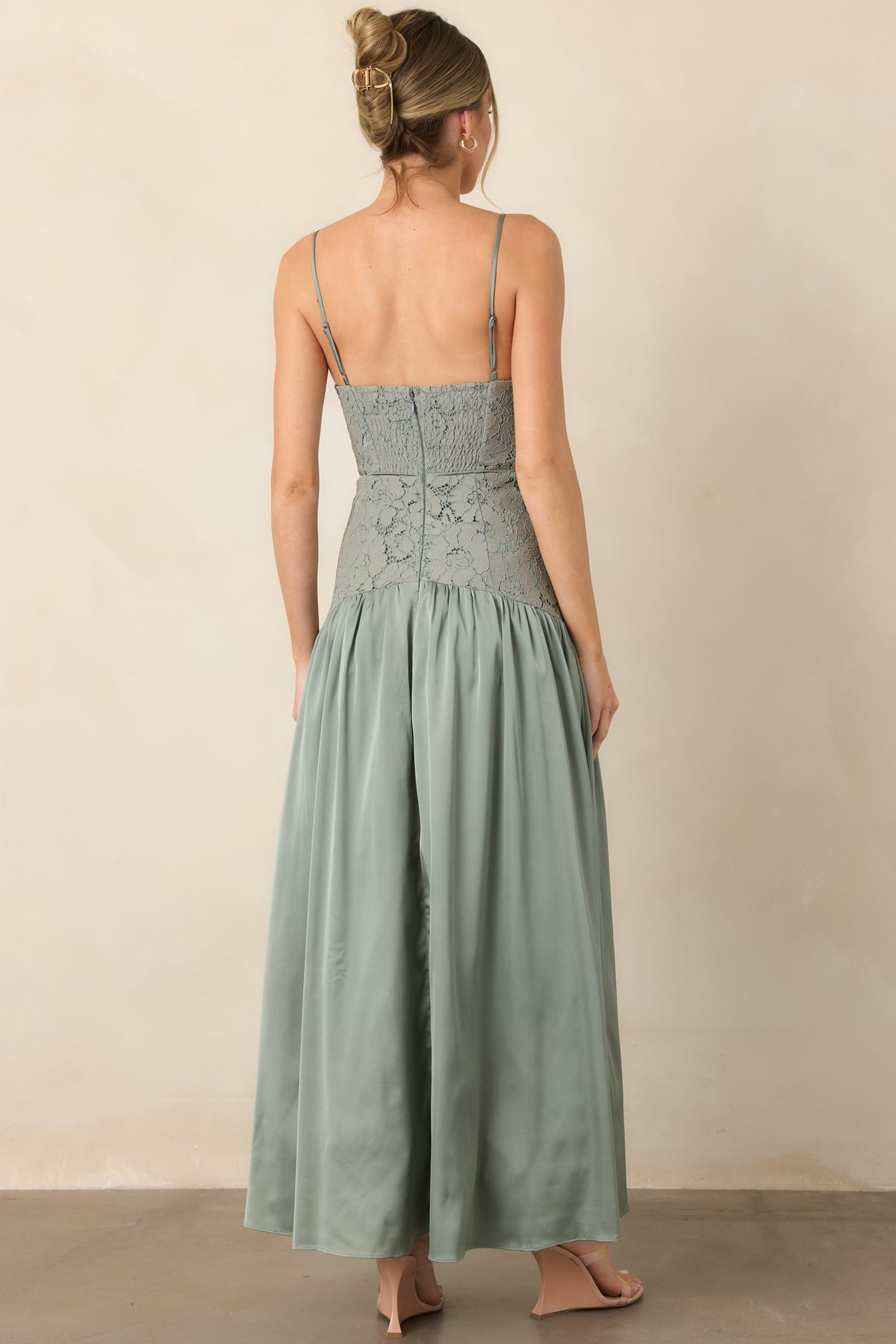 Rear of maxi dress showing partially smocked back and center-back zipper.