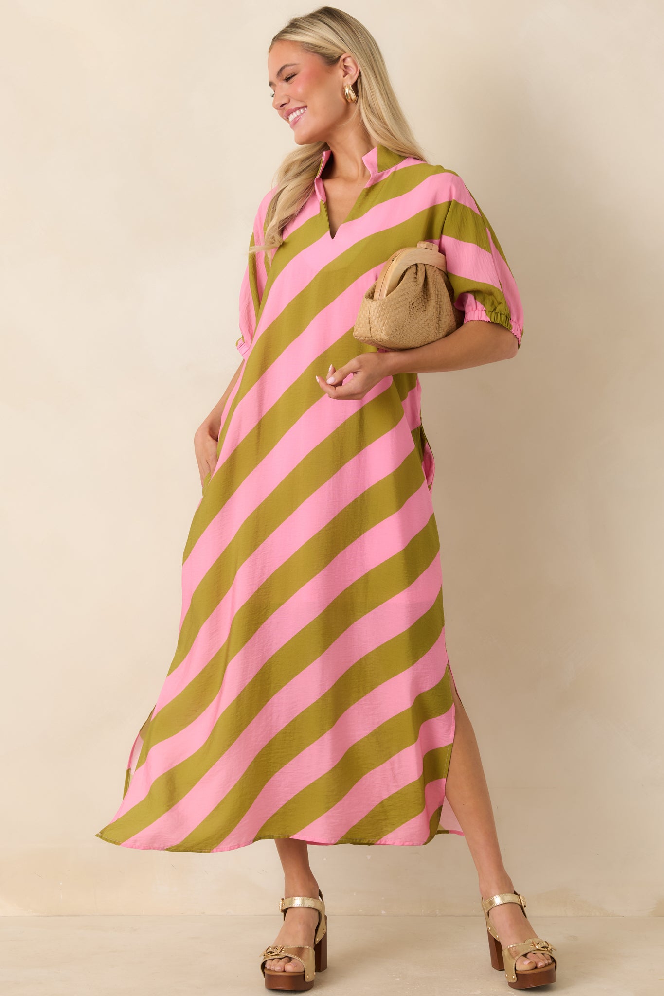 Maxi dress with breezy fabric, side slits, and effortless, feminine silhouette.