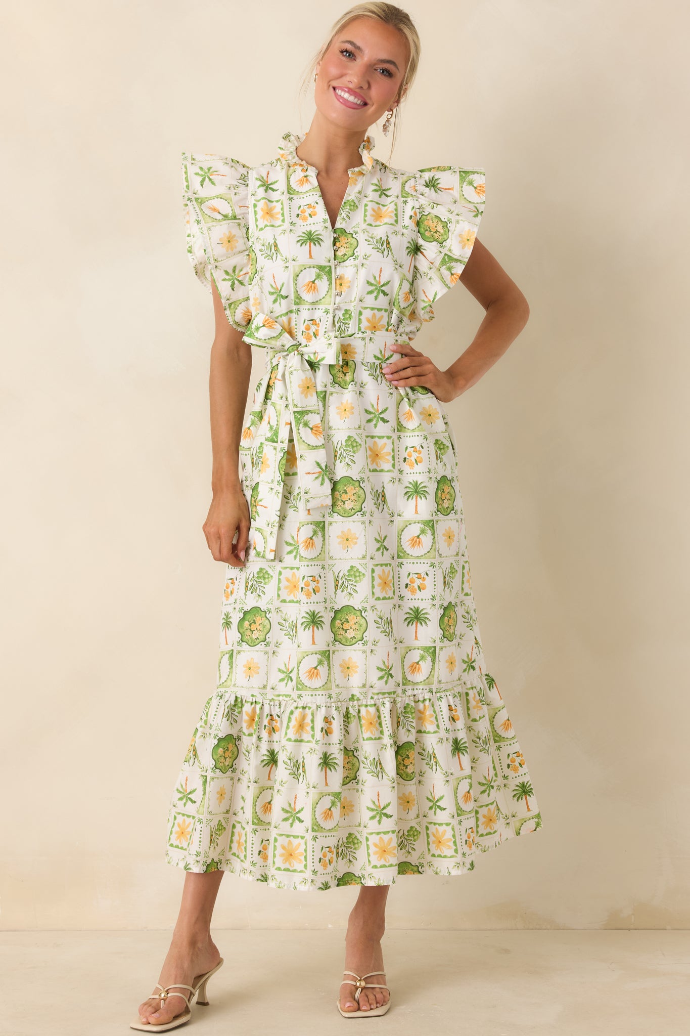 Maxi dress with gathered tiers, side pockets, and playful tropical-inspired pattern.