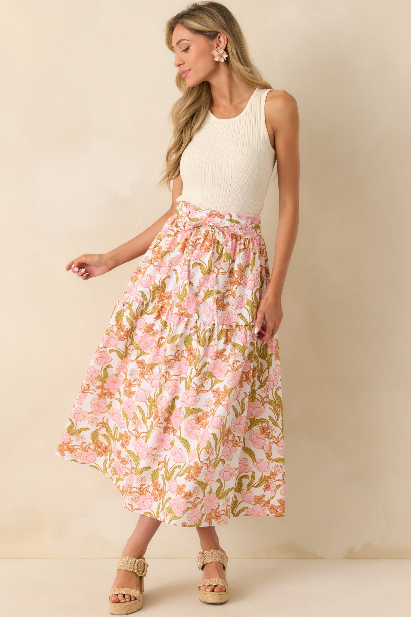 Front view of the maxi skirt showcasing the pink multicolor floral print and high rise ribbed waistband.