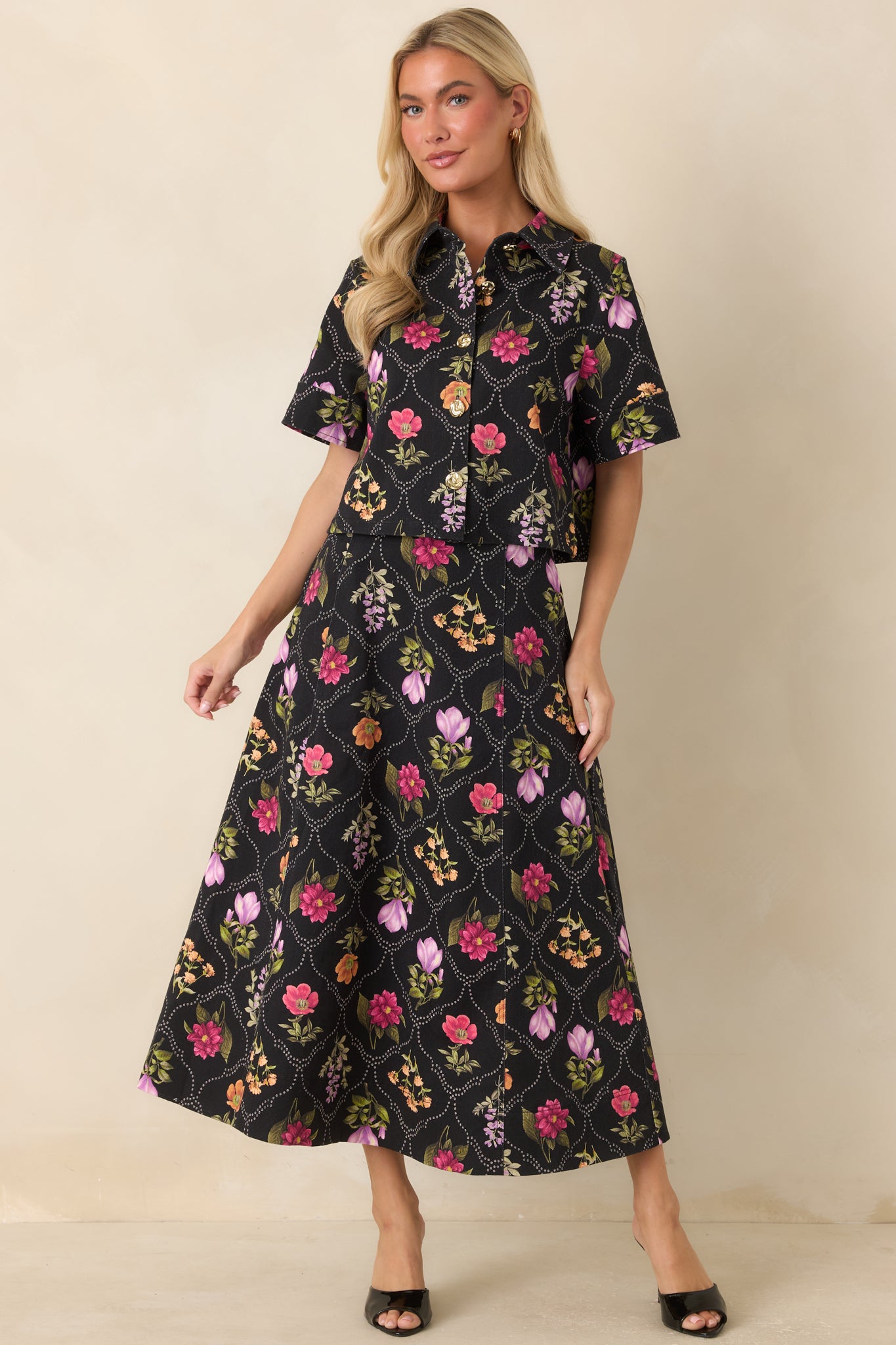 Maxi skirt with a smooth front waistband, subtle pleating, and a gracefully structured shape.
