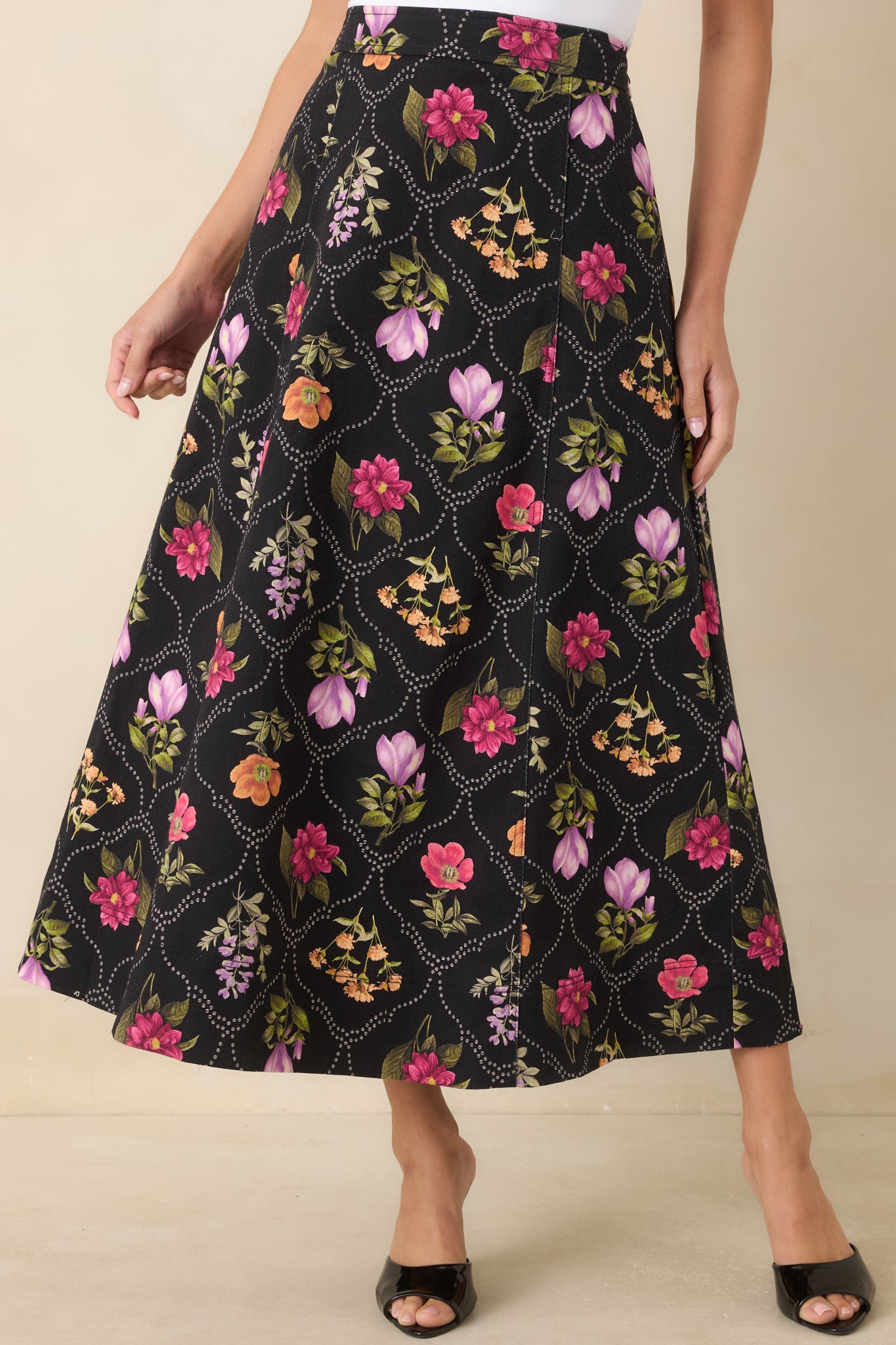 The front of this maxi skirt highlights the vibrant botanical print and flowing A-line construction.