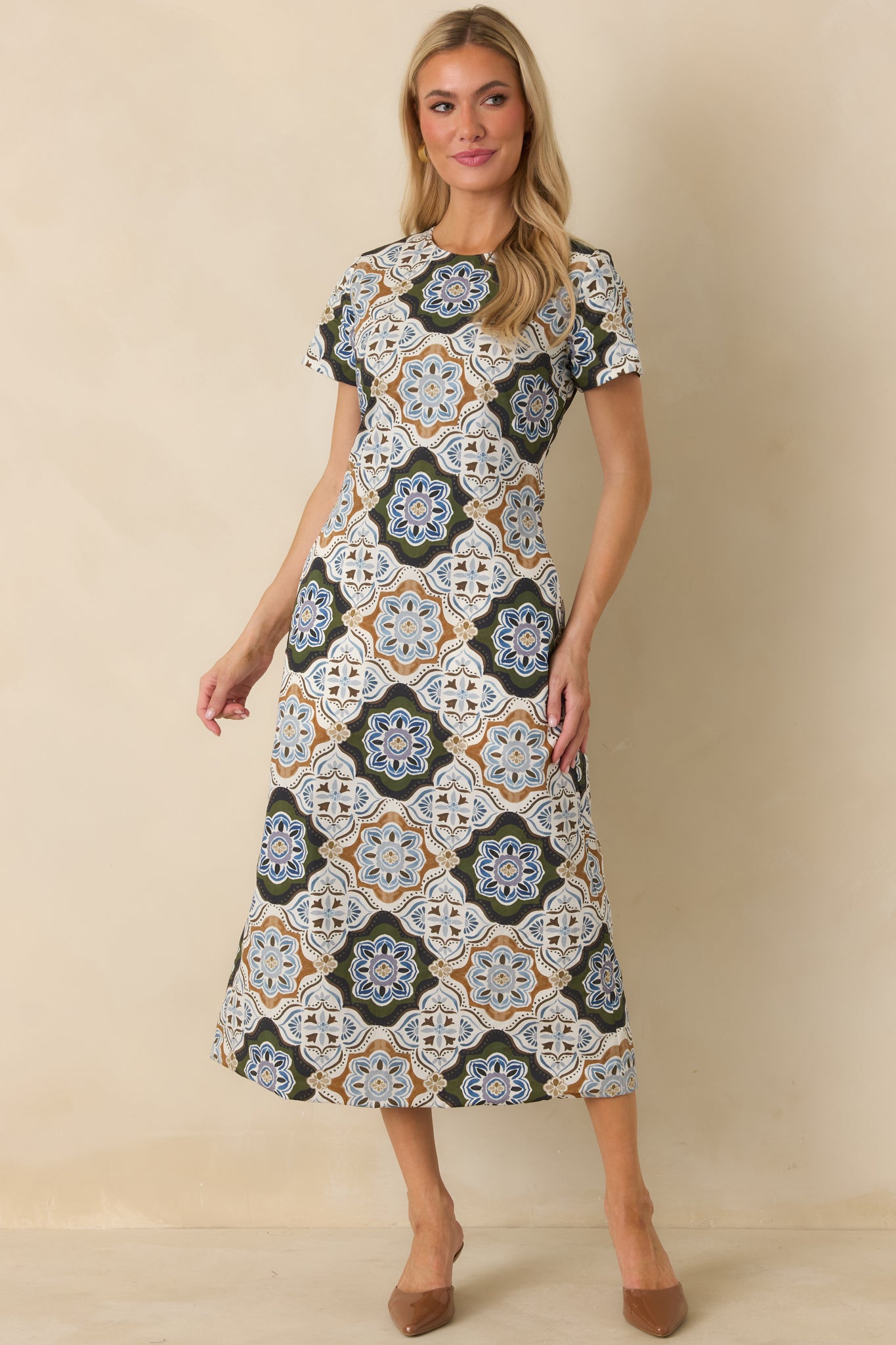 Intricate medallion print reversible dress featuring olive, blue, ivory, and camel tones with a classic A-line silhouette.