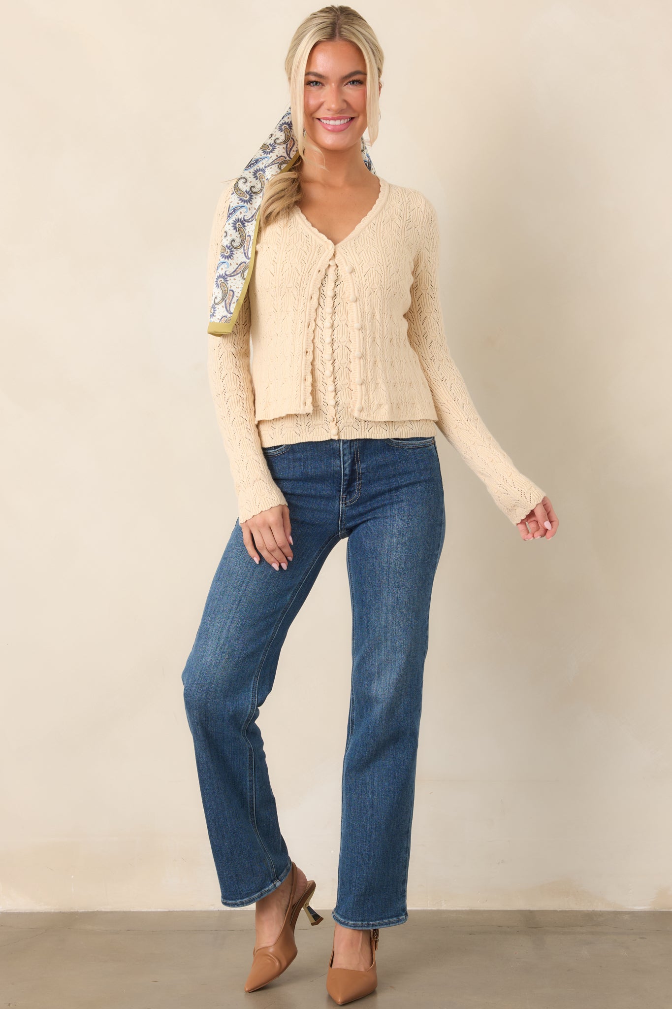 Classic medium blue denim with a flattering high-rise fit, clean straight legs, softly faded accents, and traditional five-pocket construction.