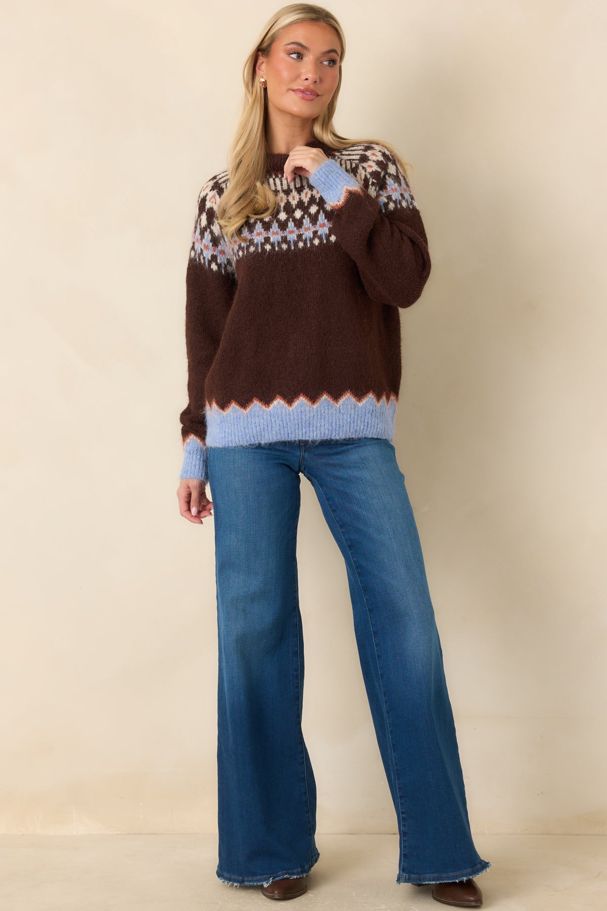 Medium blue wide-leg jeans with five-pocket styling, reinforced belt loops, and lightly frayed hems.