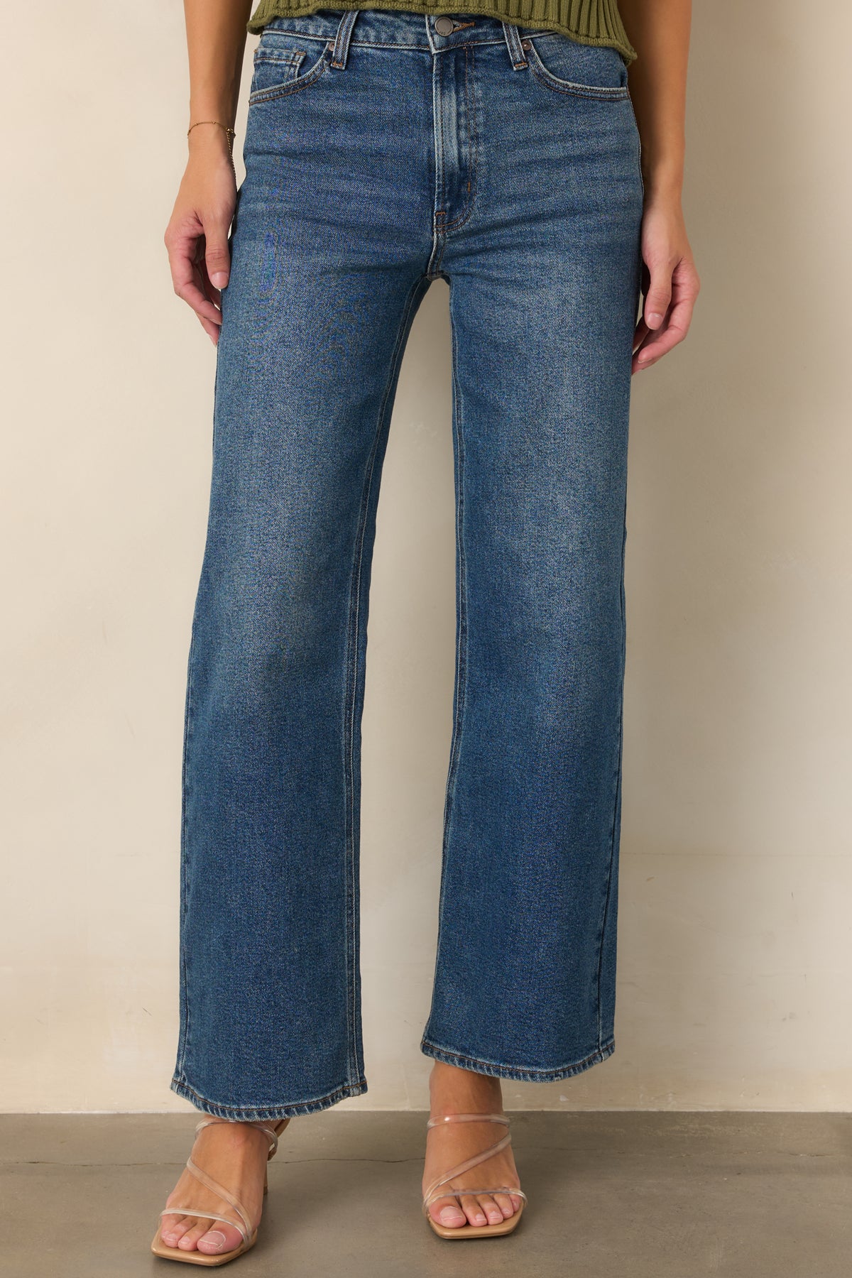 Medium wash jeans featuring a clean waistband and classic five-pocket construction.

