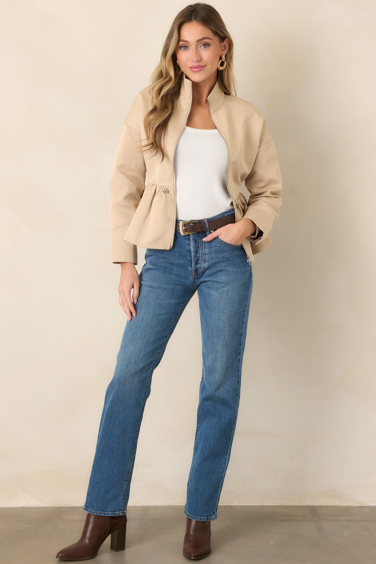 Medium wash jeans featuring a relaxed straight-leg silhouette from hip to hem.