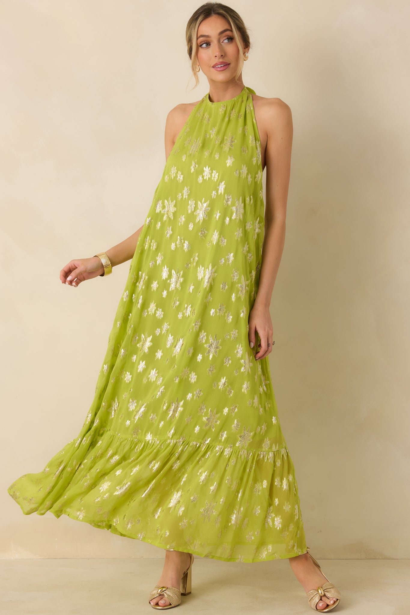 Metallic floral chartreuse dress designed with a relaxed silhouette and softly tiered maxi-length skirt.