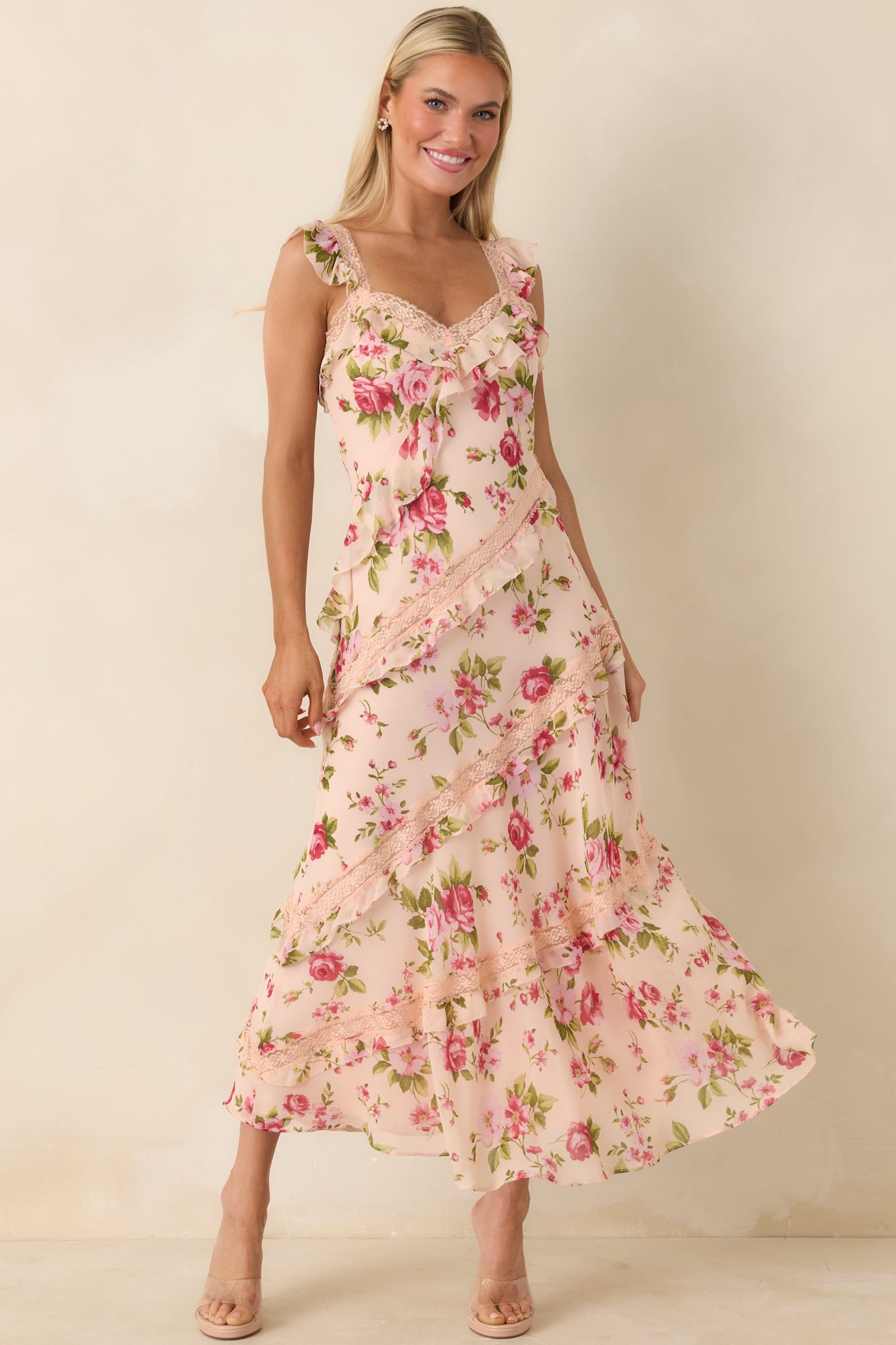 Lightweight midi dress featuring fluttery straps, lace detailing, and layered ruffles creating soft movement.