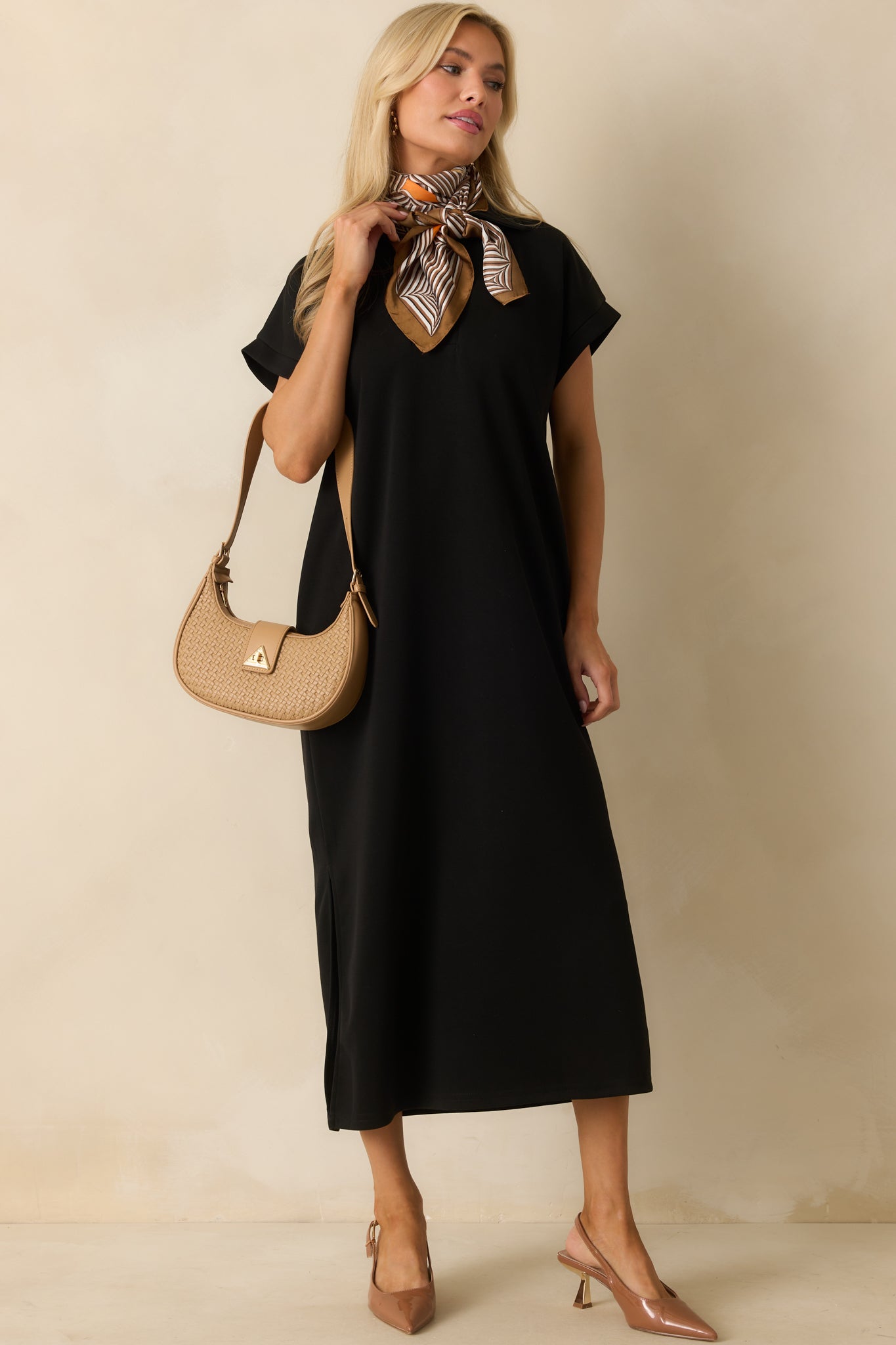 Midi dress featuring side vent leg slits and a comfortable flowy silhouette.