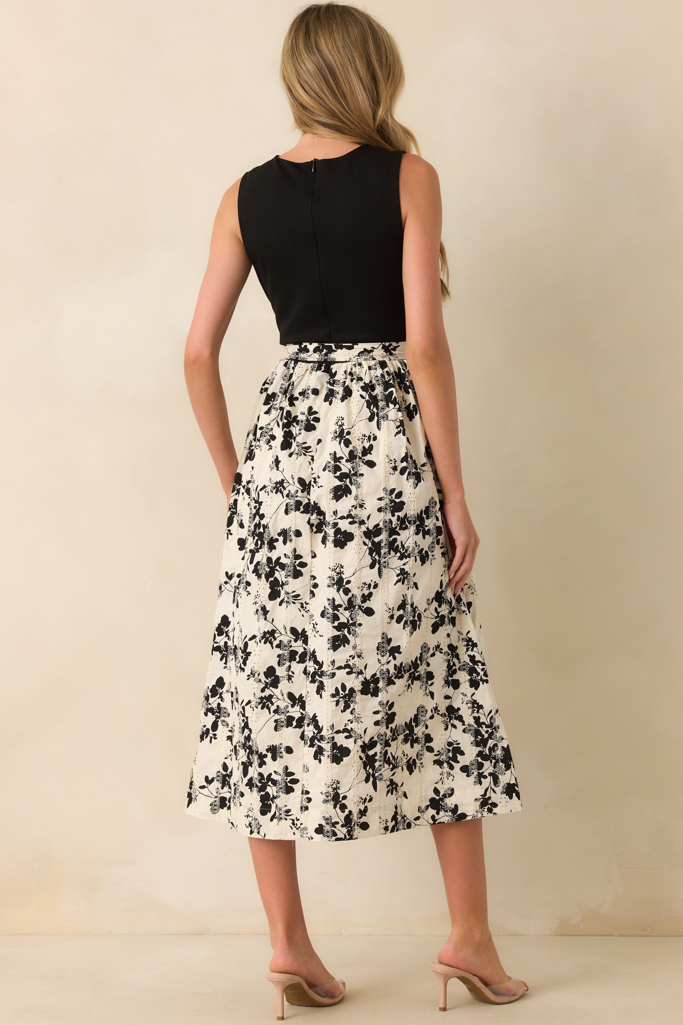 Rear view of the midi dress showing the concealed back zipper and smooth back panel.