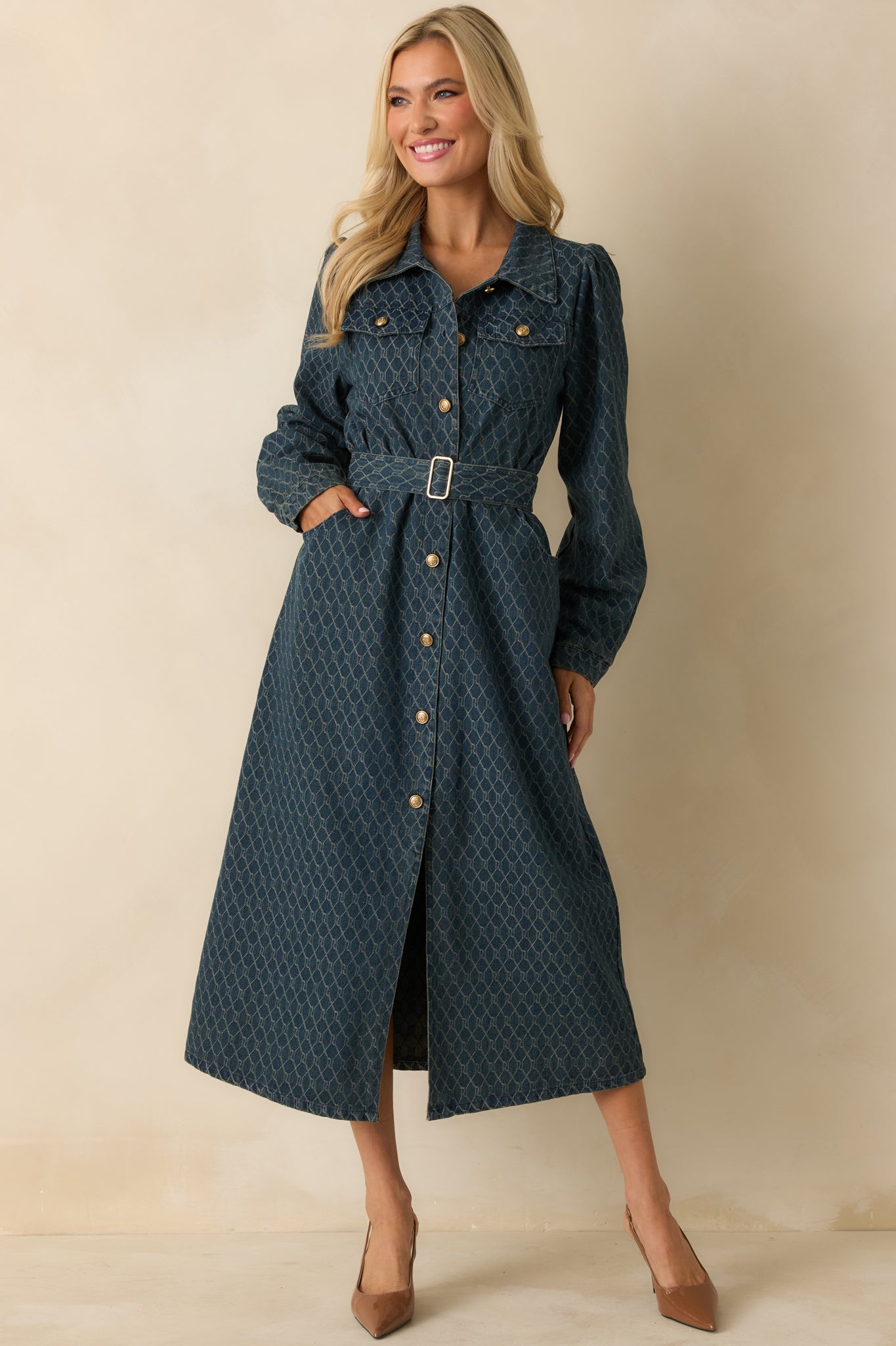 Midi dress showcasing gold-tone embossed buttons, chest pockets, and side pockets for function.