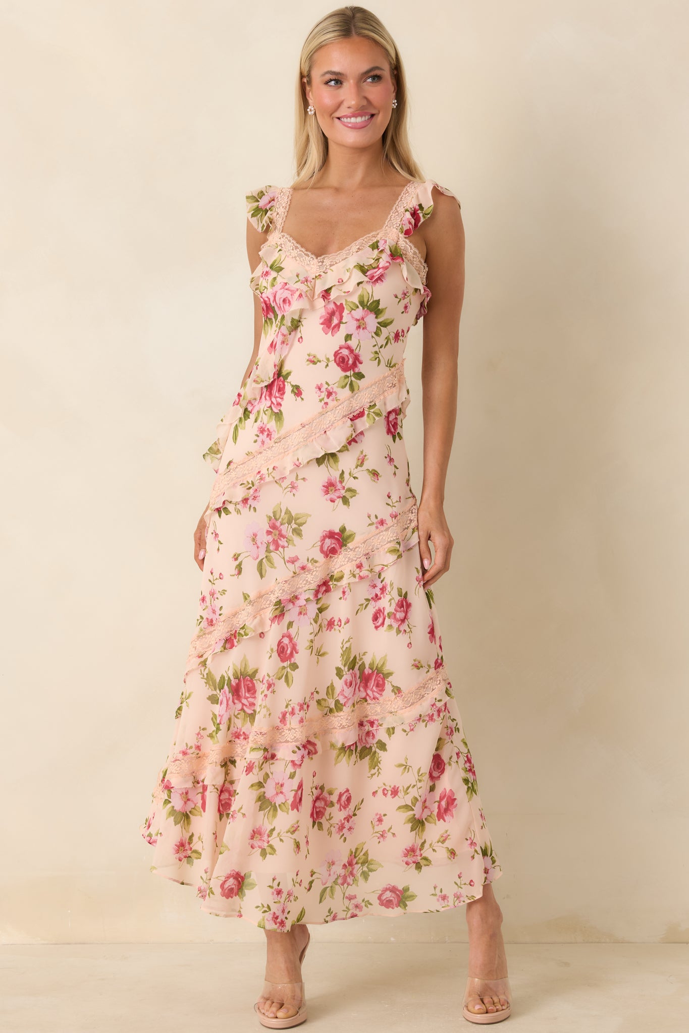 Ruffled midi dress with delicate lace accents, flutter straps, and a softly layered, flowing shape.