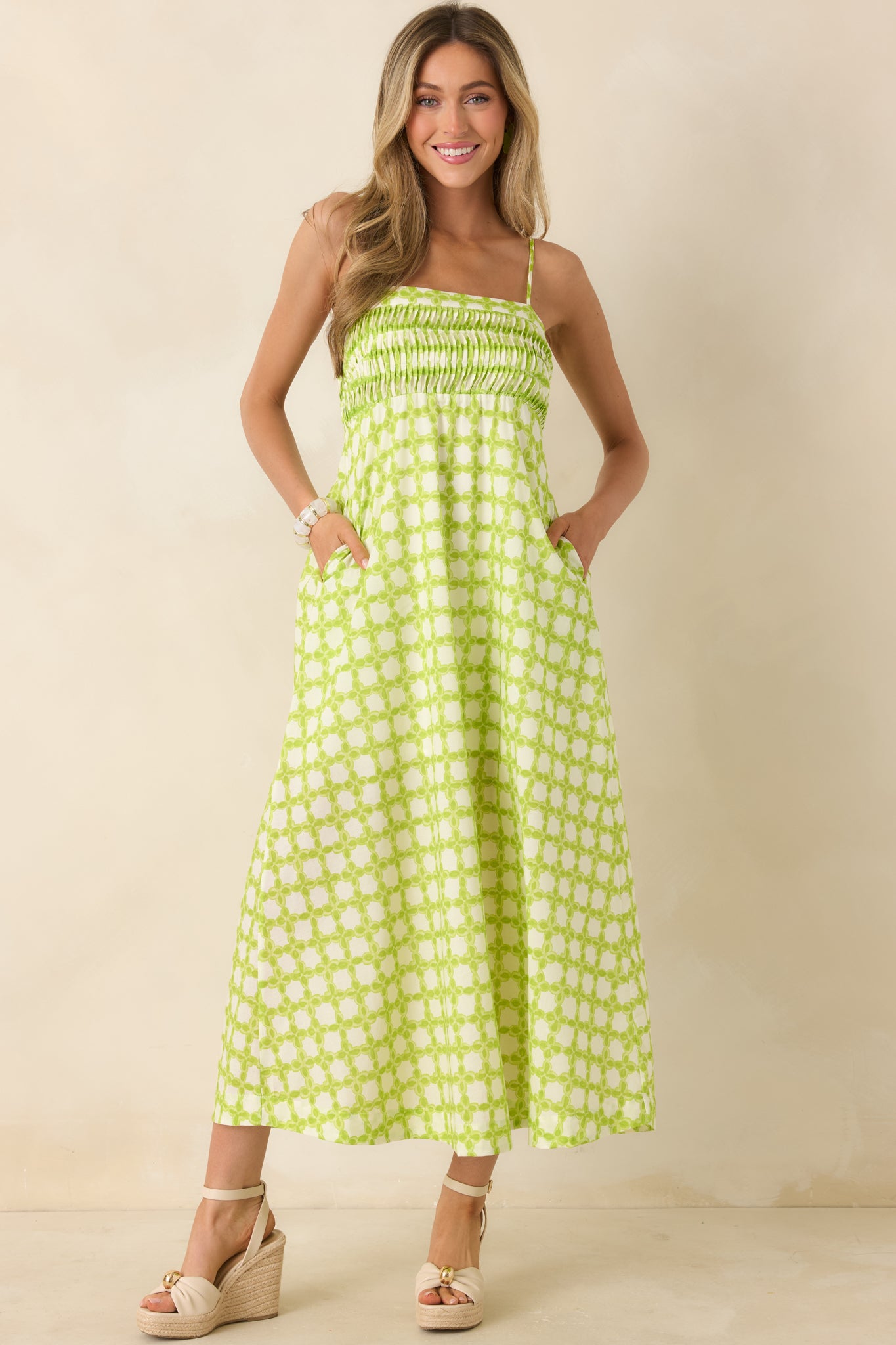 Midi-length cotton dress with textured pleating, flexible smocking, and a graceful drape.