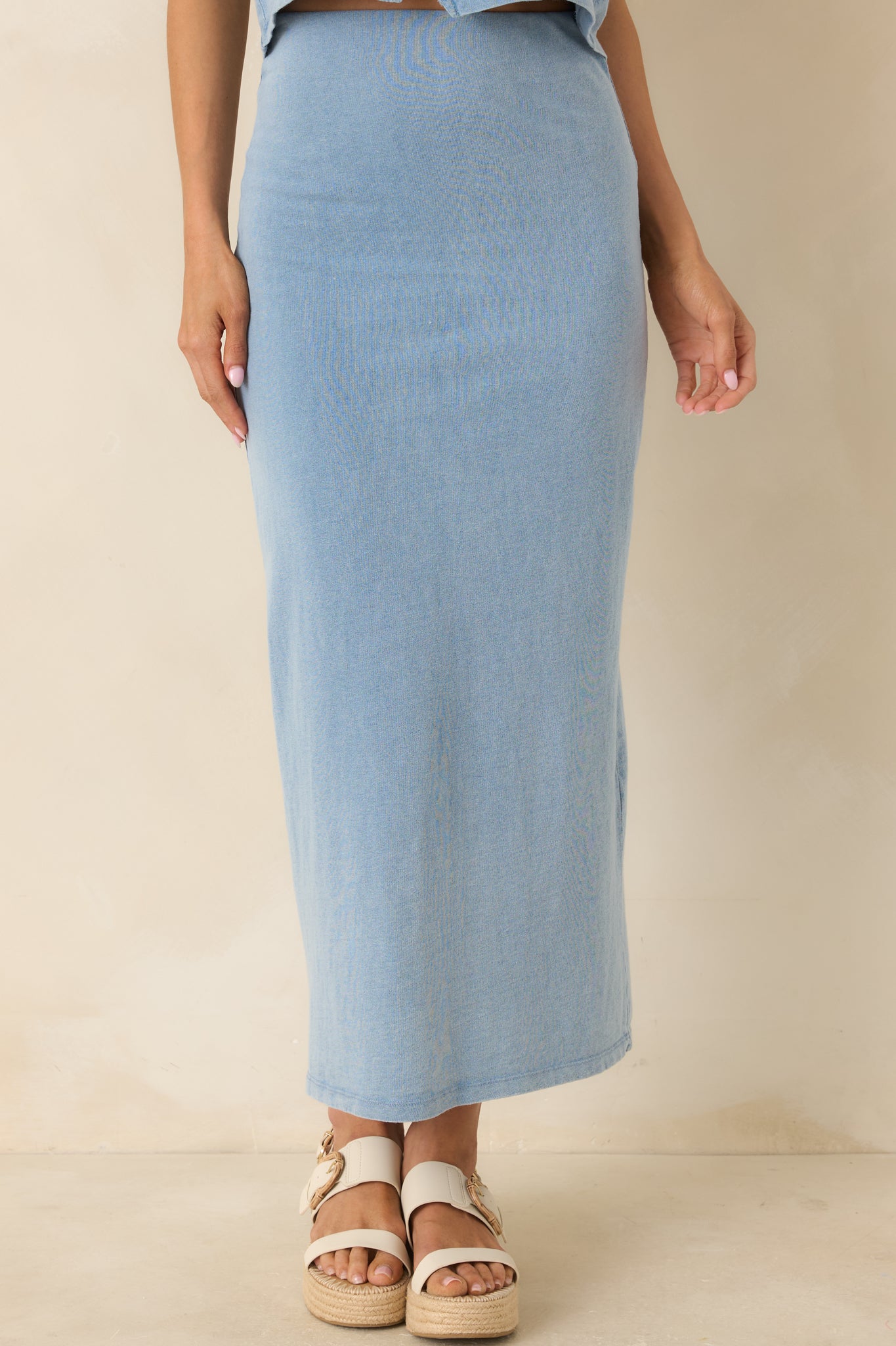 Midi-length indigo skirt, featuring a smooth cotton jersey texture and relaxed drape.