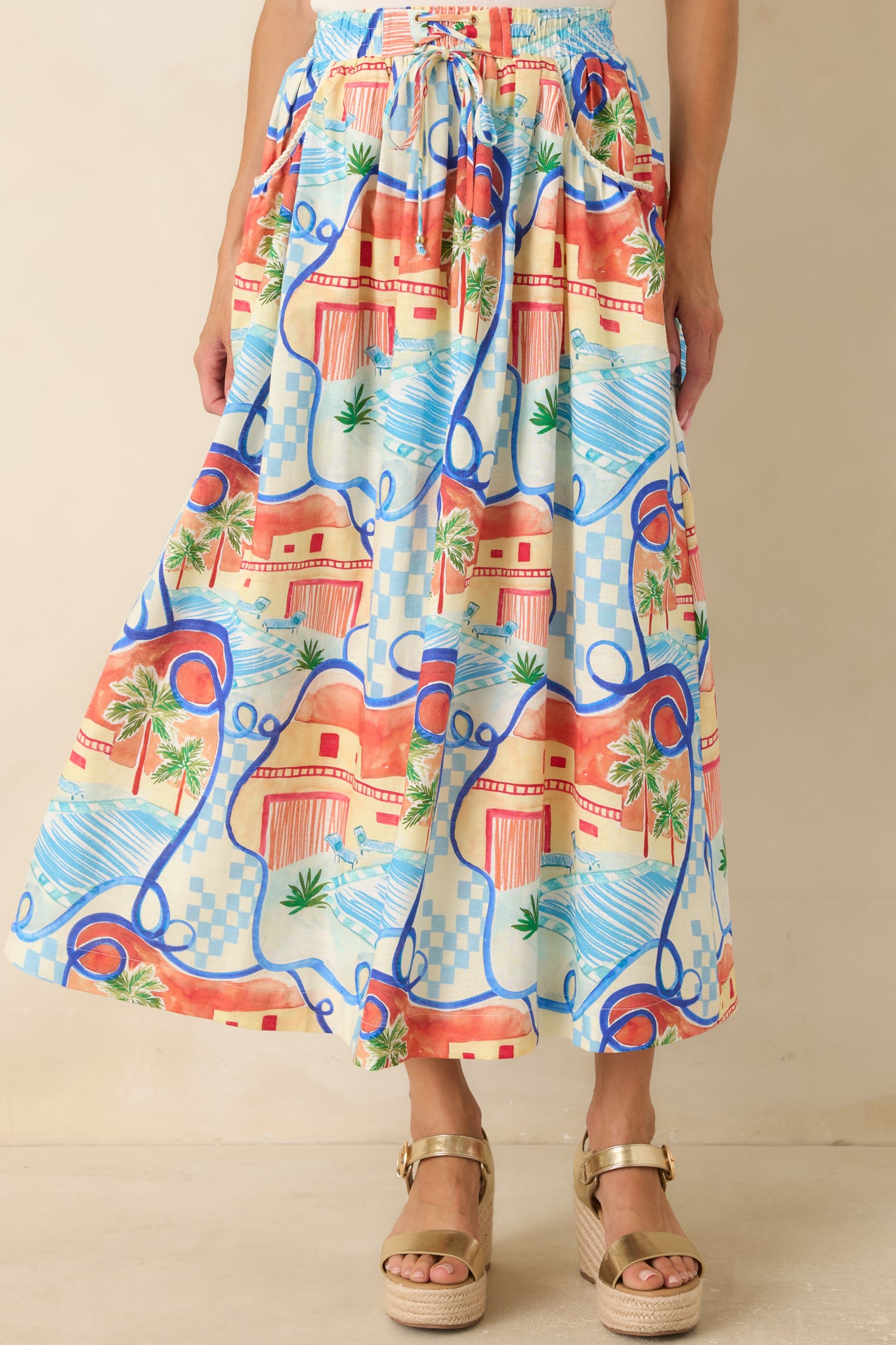 Midi skirt highlighting the flowing silhouette, colorful pattern, and functional side pocket detailing.