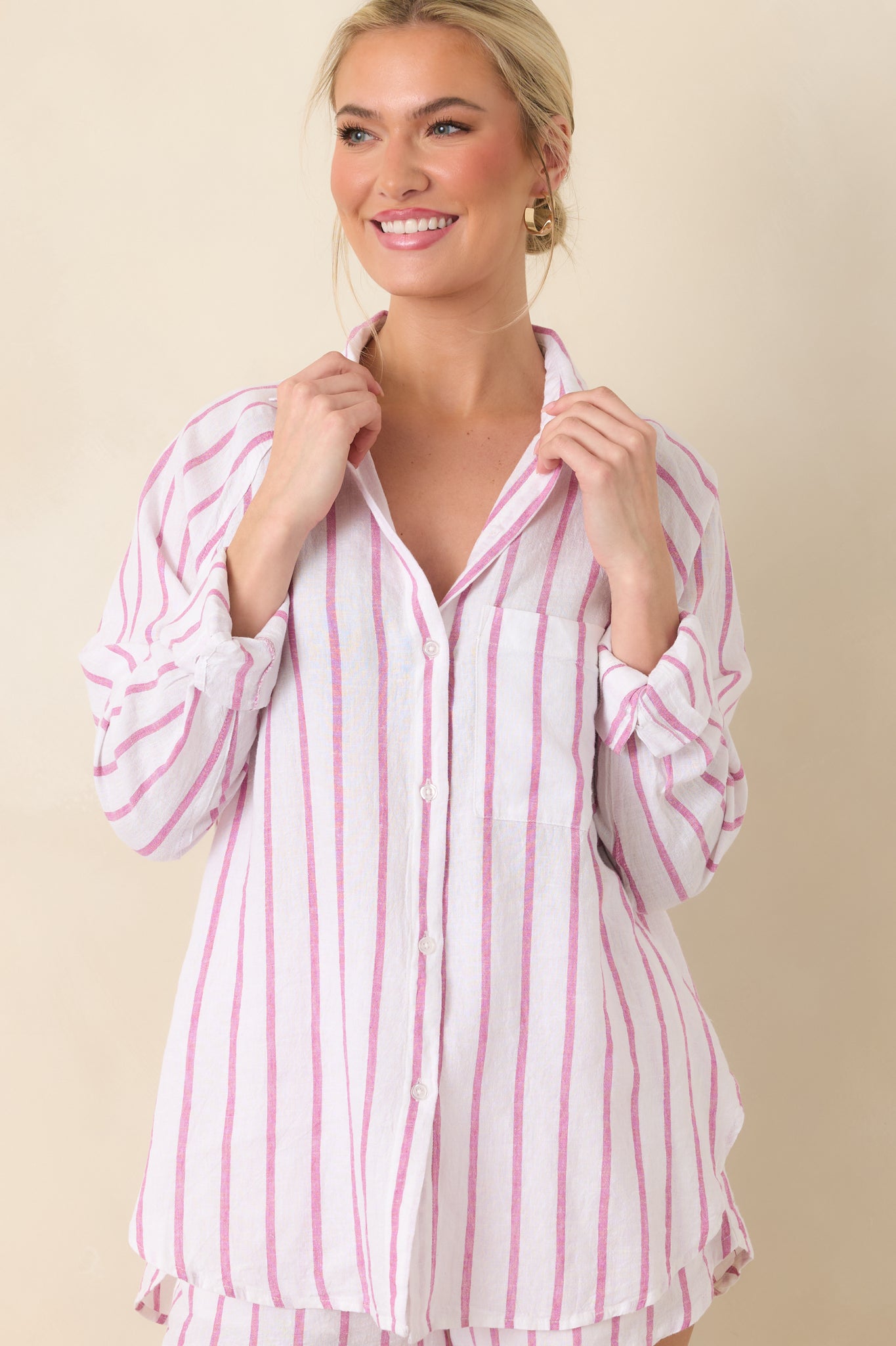Midsection detail emphasizing the relaxed fit and lightweight striped linen fabric.