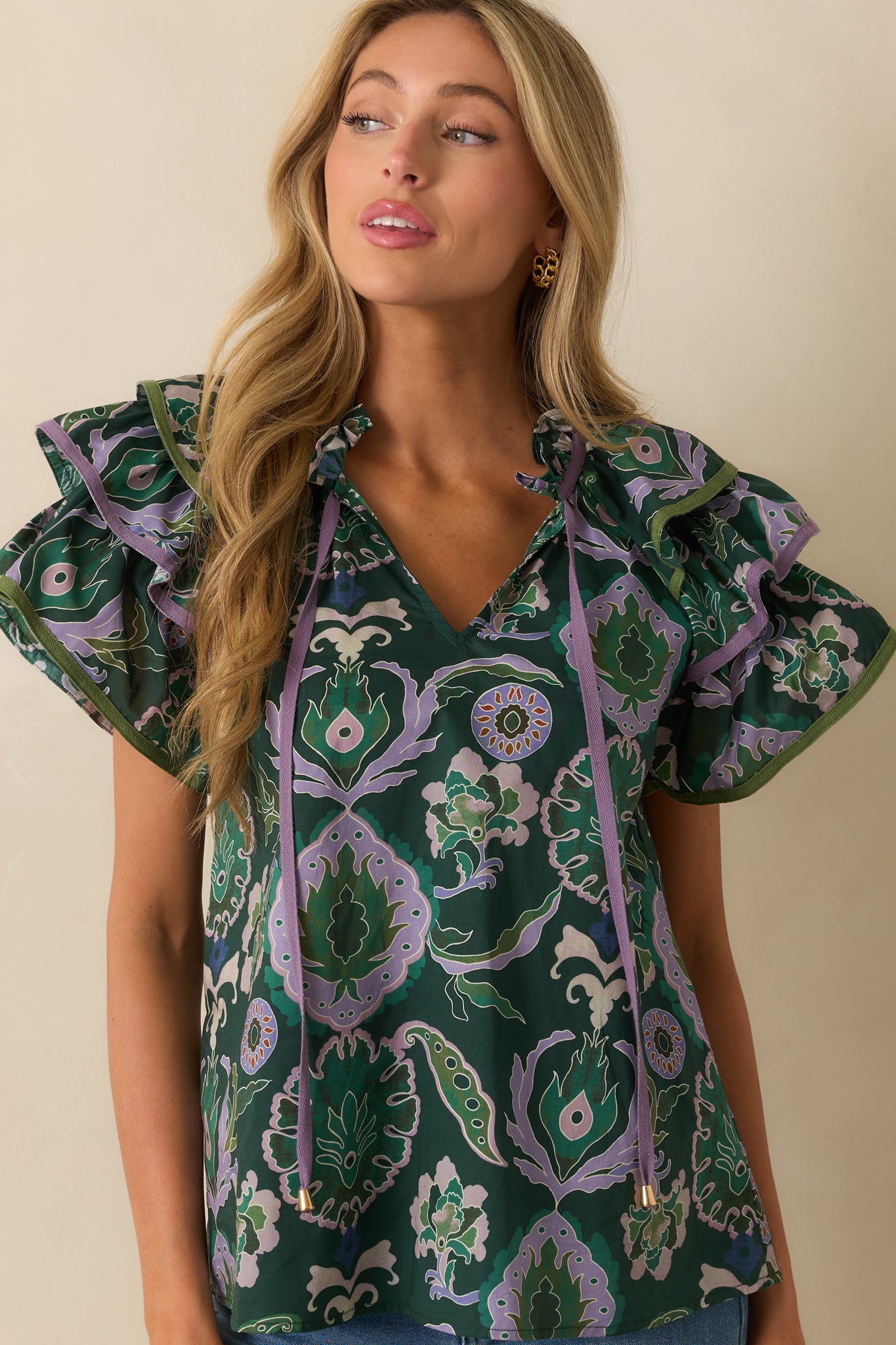 Midsection view showing relaxed fit and multicolor print across the torso.