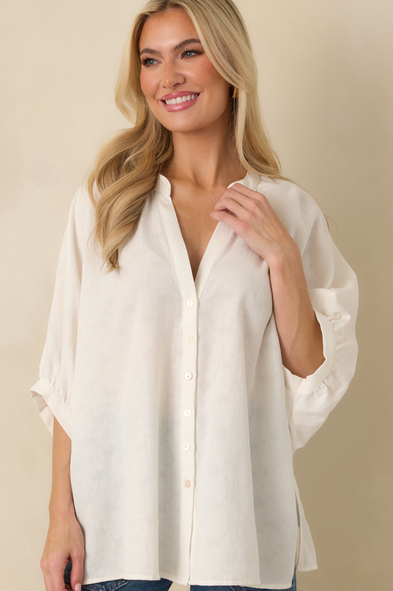 Midsection view showing relaxed fit and smooth flowing fabric through the torso.