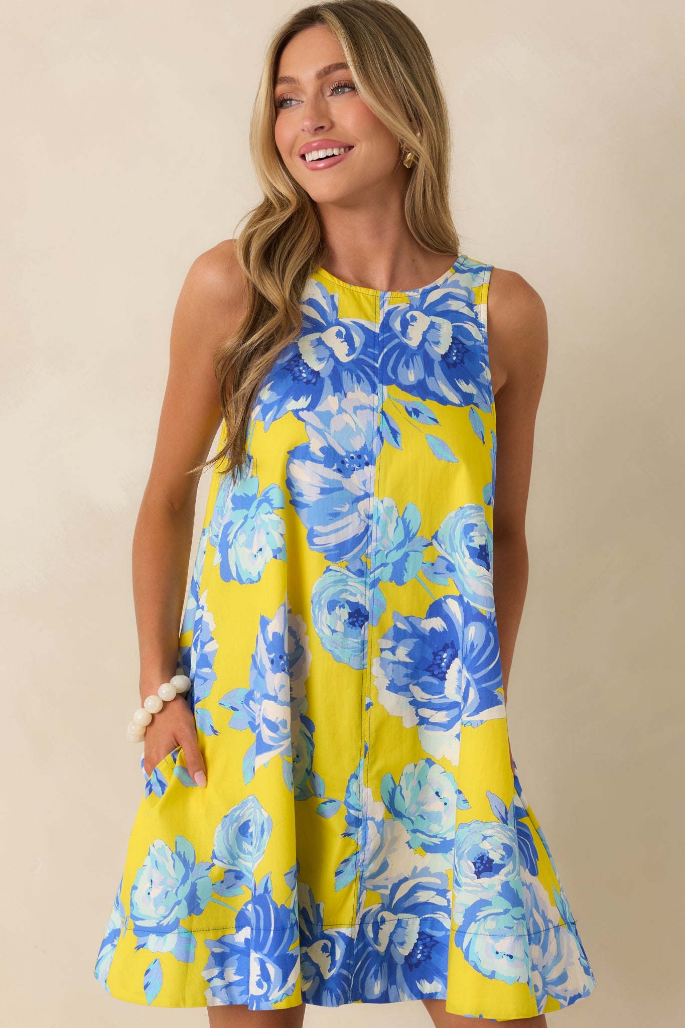 Close-up of the mini-length hemline and flowing cotton construction.