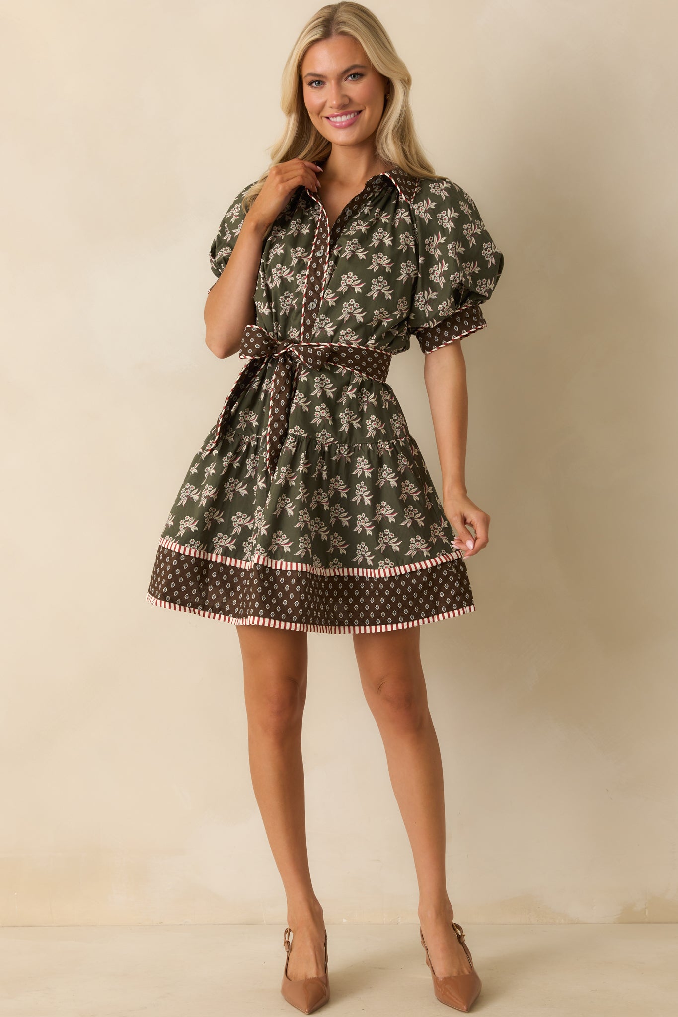 Mini dress with short puff sleeves, collared neckline, and relaxed silhouette with pockets.