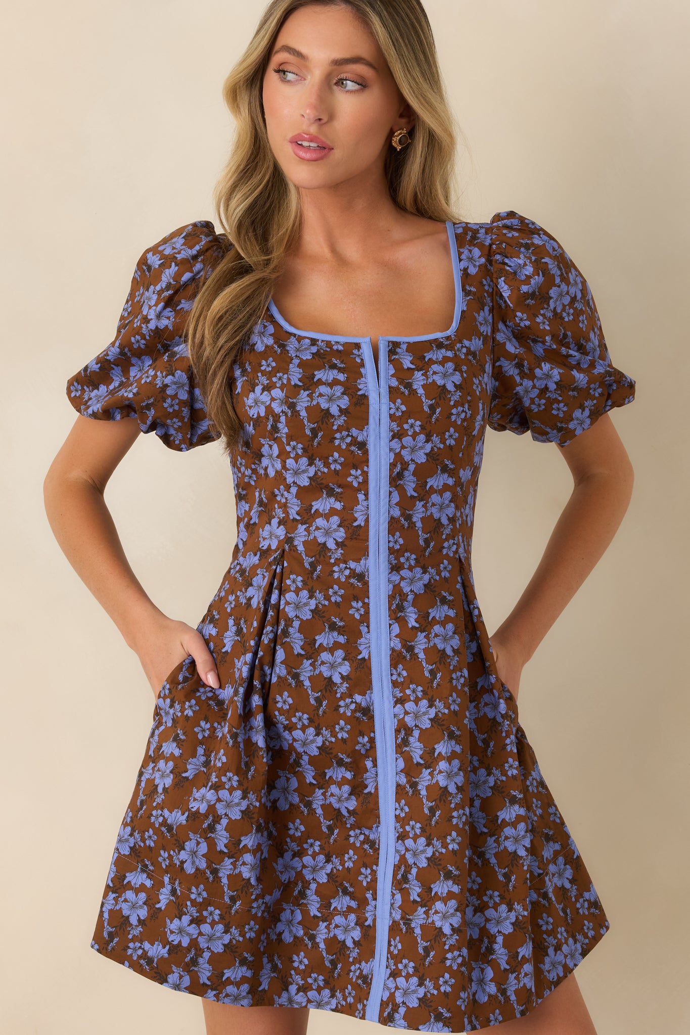 Mini dress featuring a contrast blue panel, square neckline, and softly flared skirt for a polished finish.