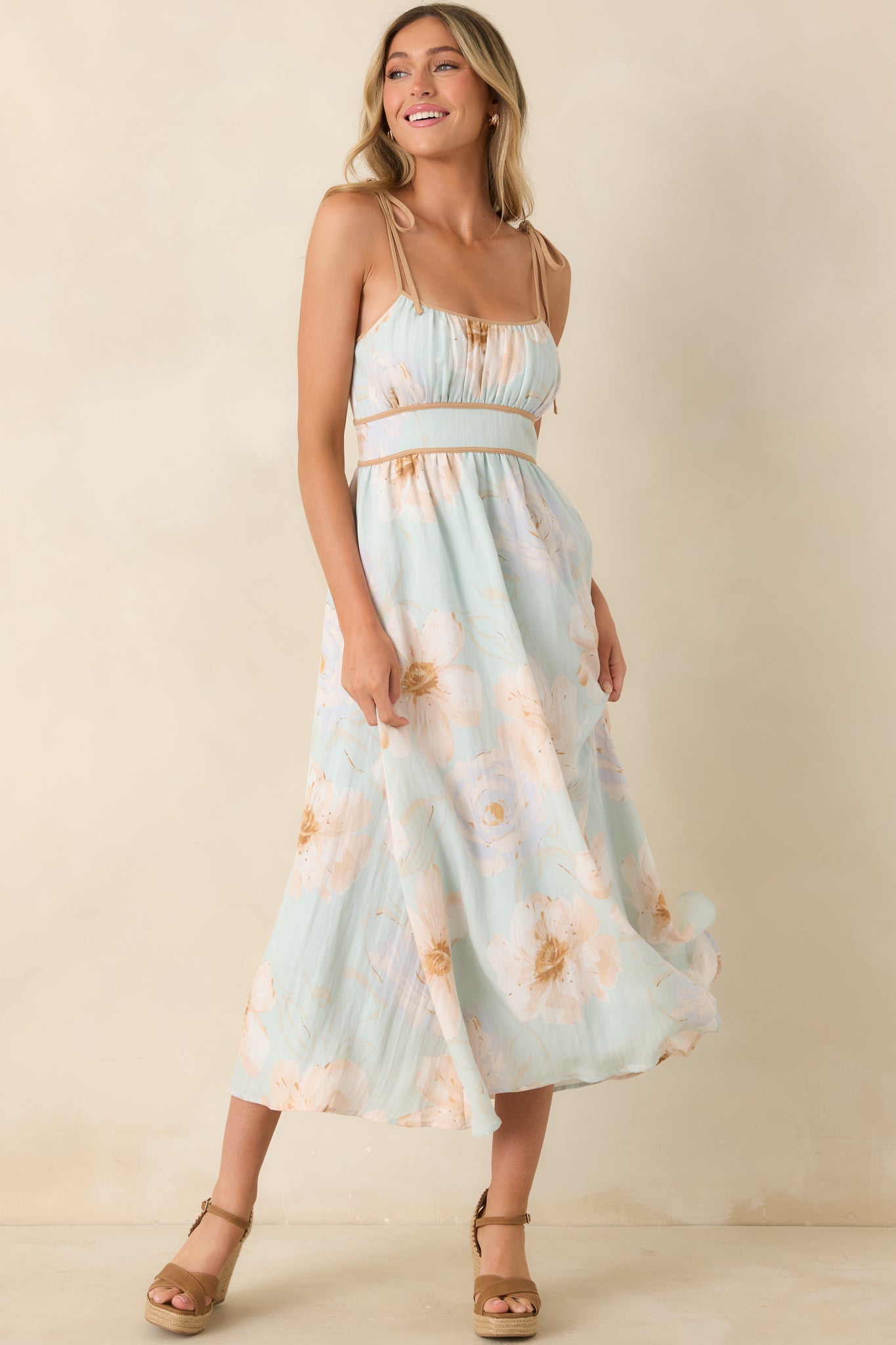 Mint green dress highlighting oversized floral artwork, a comfortable fit, and a softly draped skirt for an elegant finish.