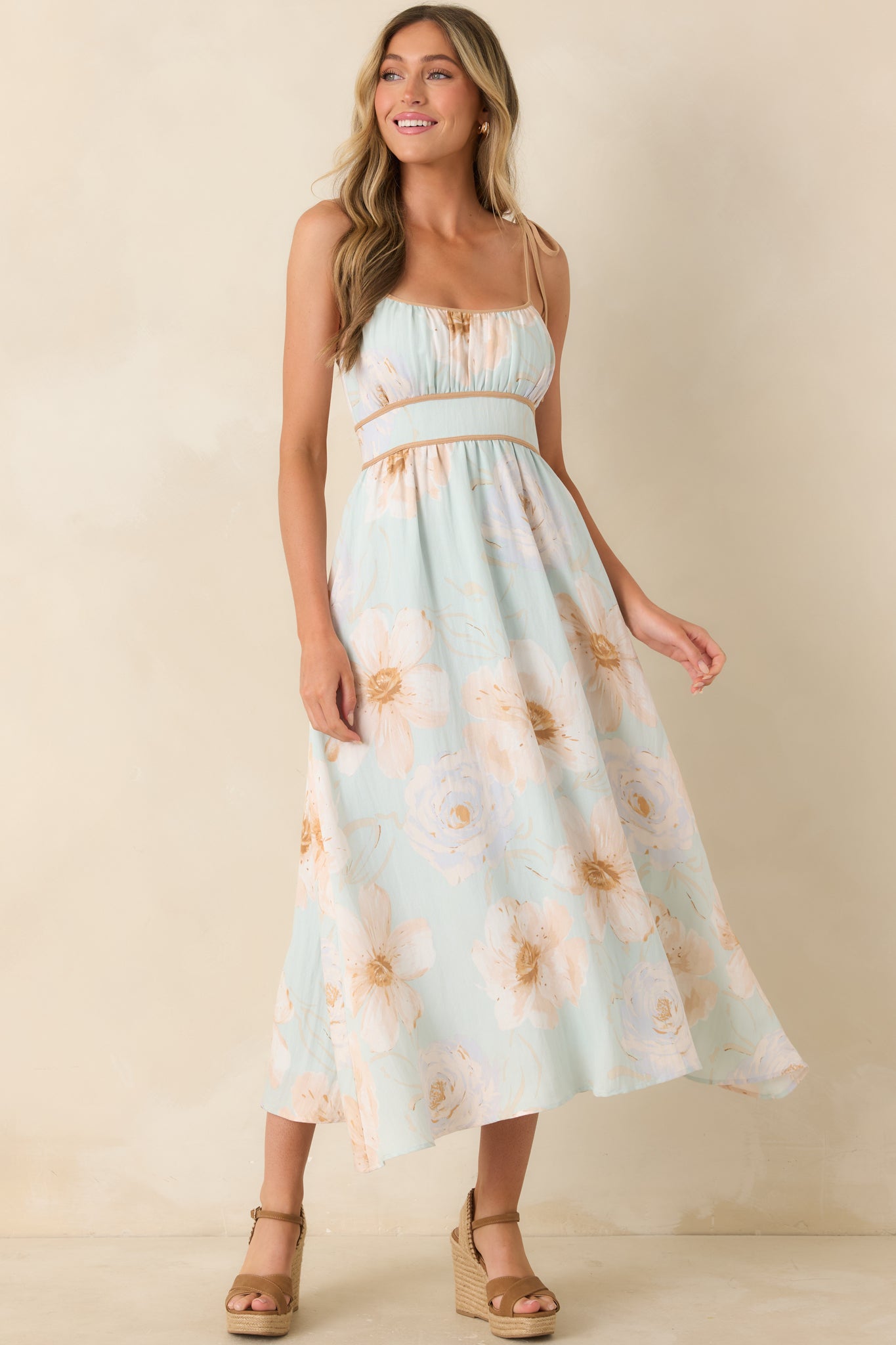 Mint green floral dress with watercolor-inspired prints, a flattering smocked back, and an effortlessly flowing skirt.
