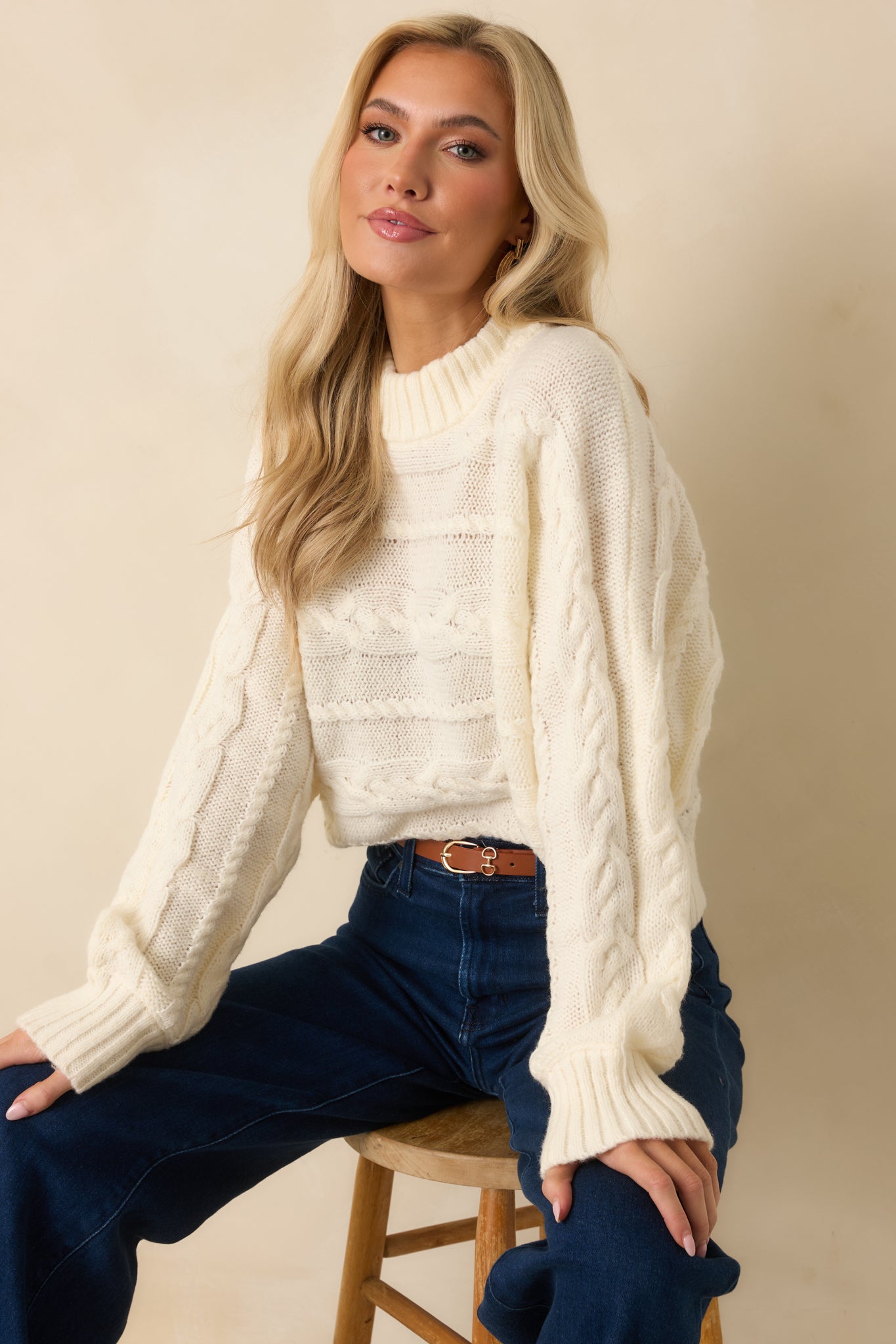 Look at mixed cable design across the torso and soft knit texture.
