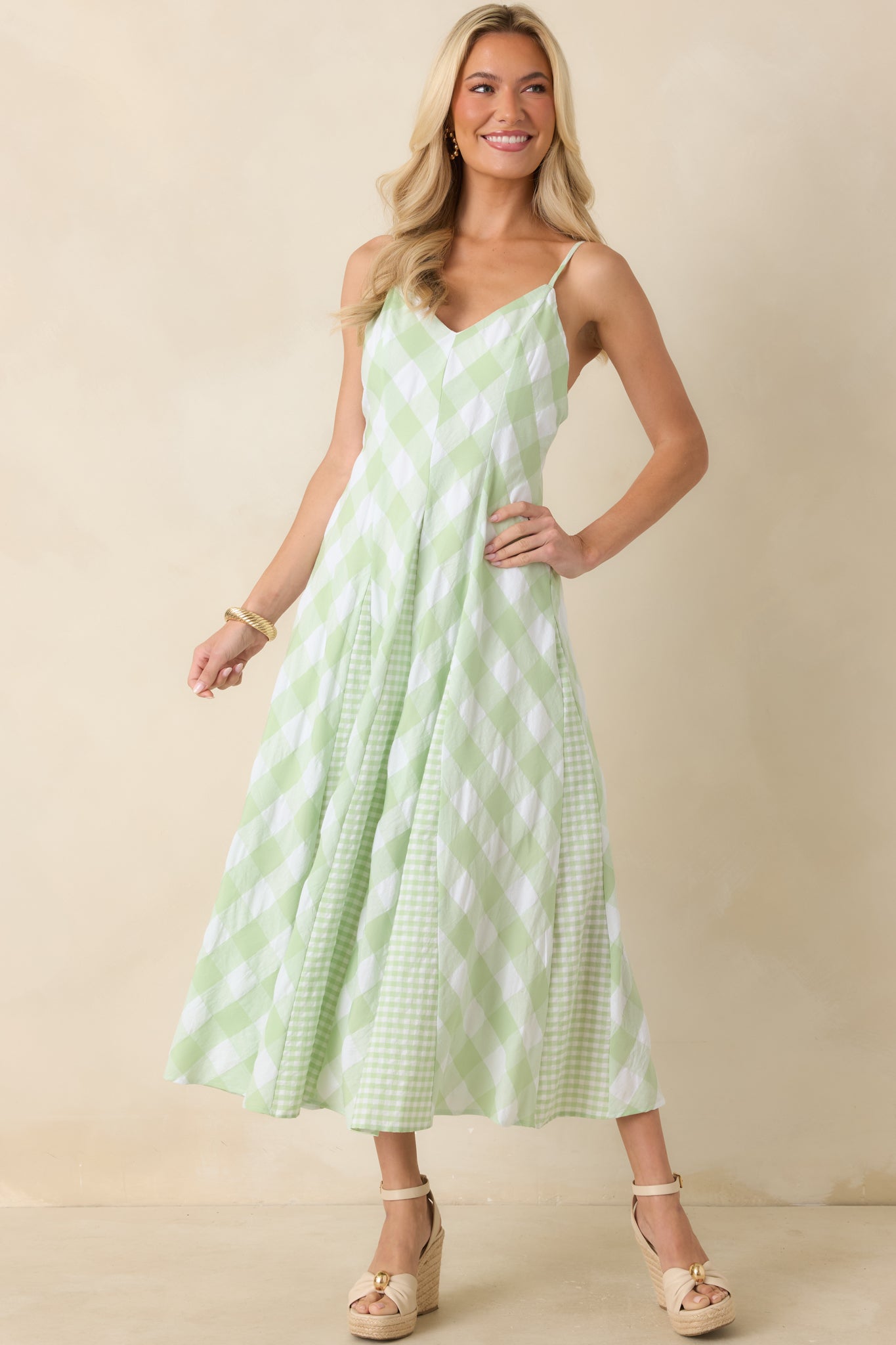 Midi dress showcasing oversized and petite gingham panels arranged throughout a flattering flowing silhouette.