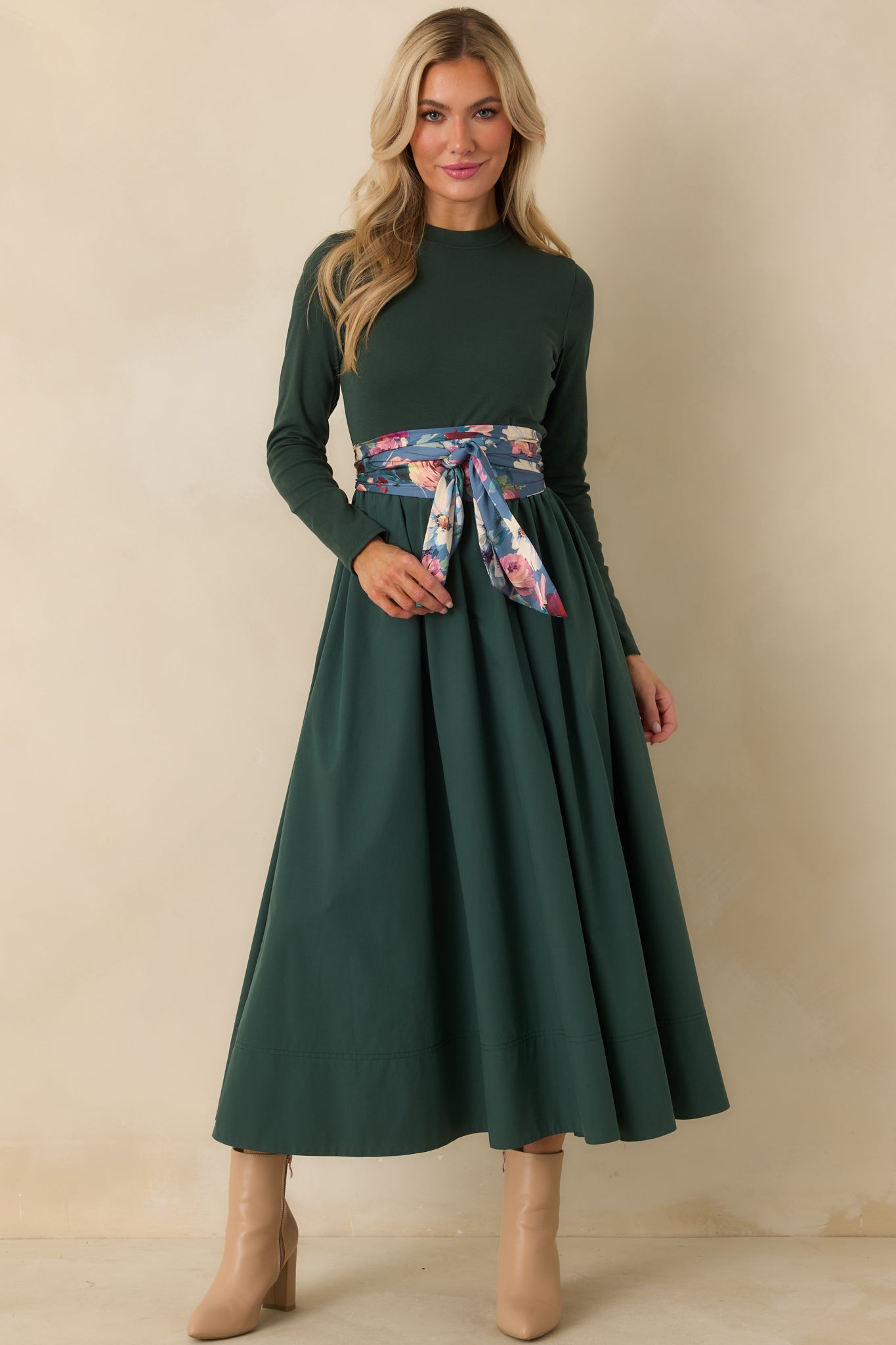 Mixed-media green midi dress with a close-fitting round neck bodice, gathered waistline, side pockets, and full A-line skirt.