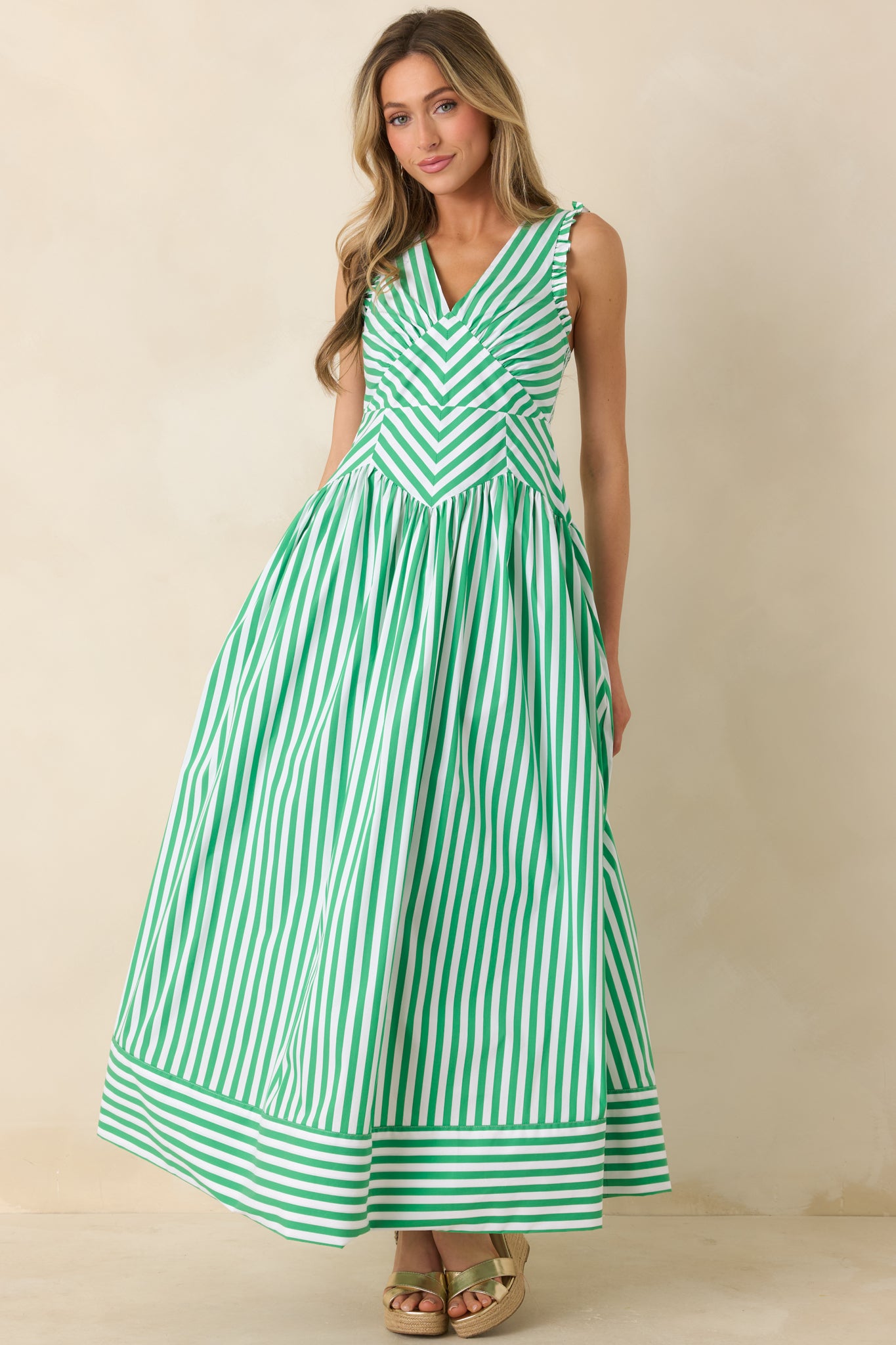 Mixed stripe midi dress with defined bodice and relaxed gathered skirt.