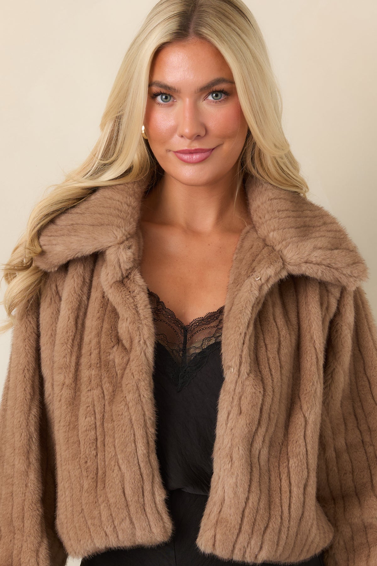 Mocha brown faux fur jacket showcasing the front hook-and-eye closures and textured finish.