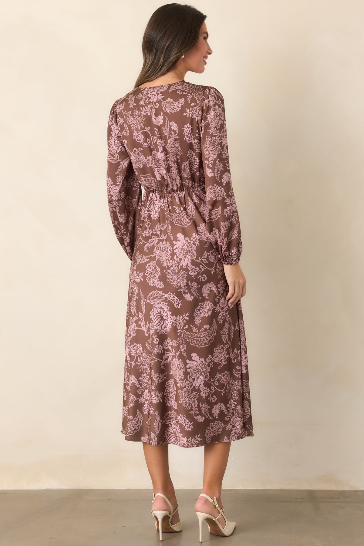 Mocha brown floral midi dress showcasing the elastic back waist and flowing skirt from the rear.
